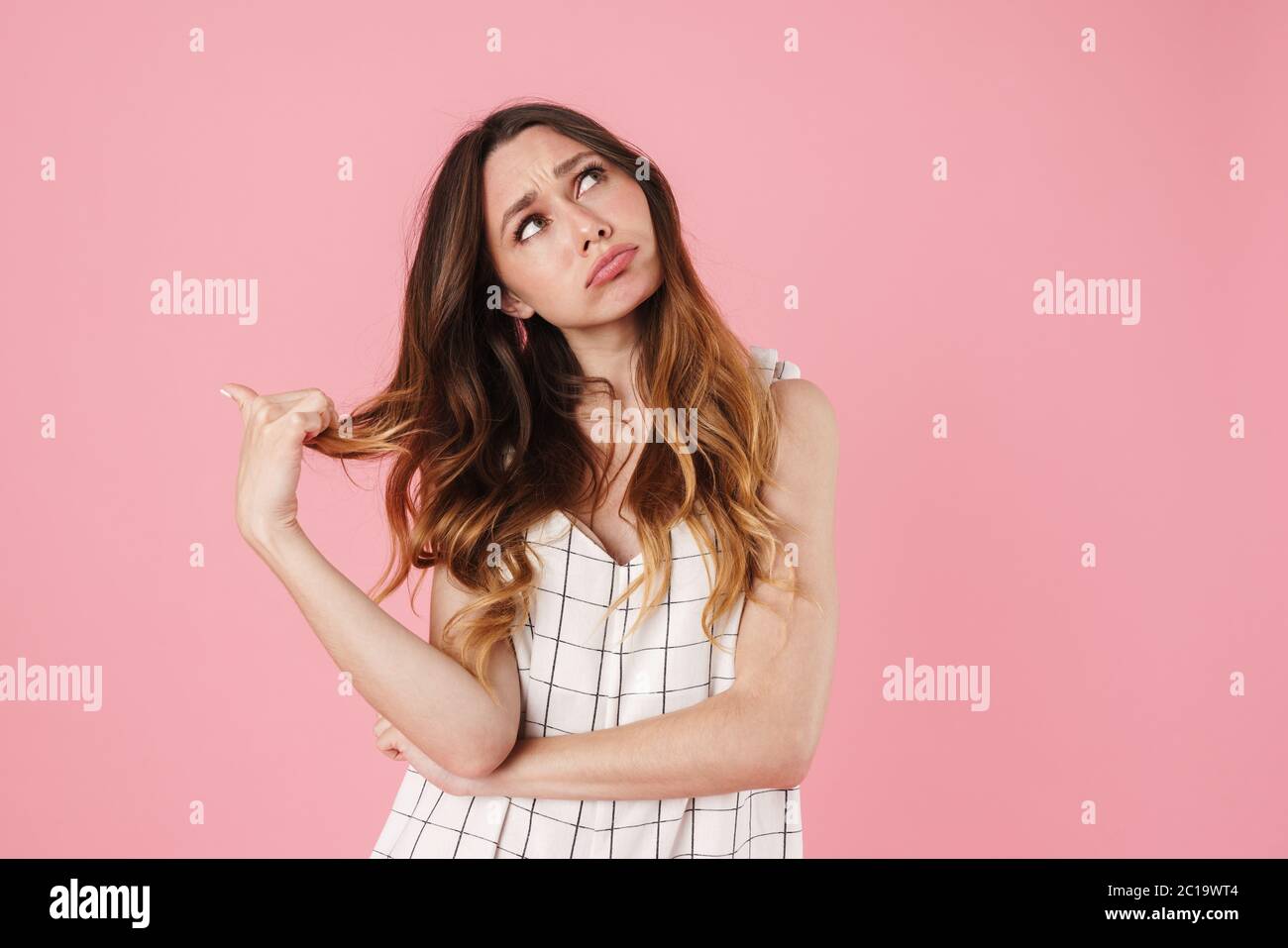 Image of unhappy beautiful woman posing and looking upward isolated ...