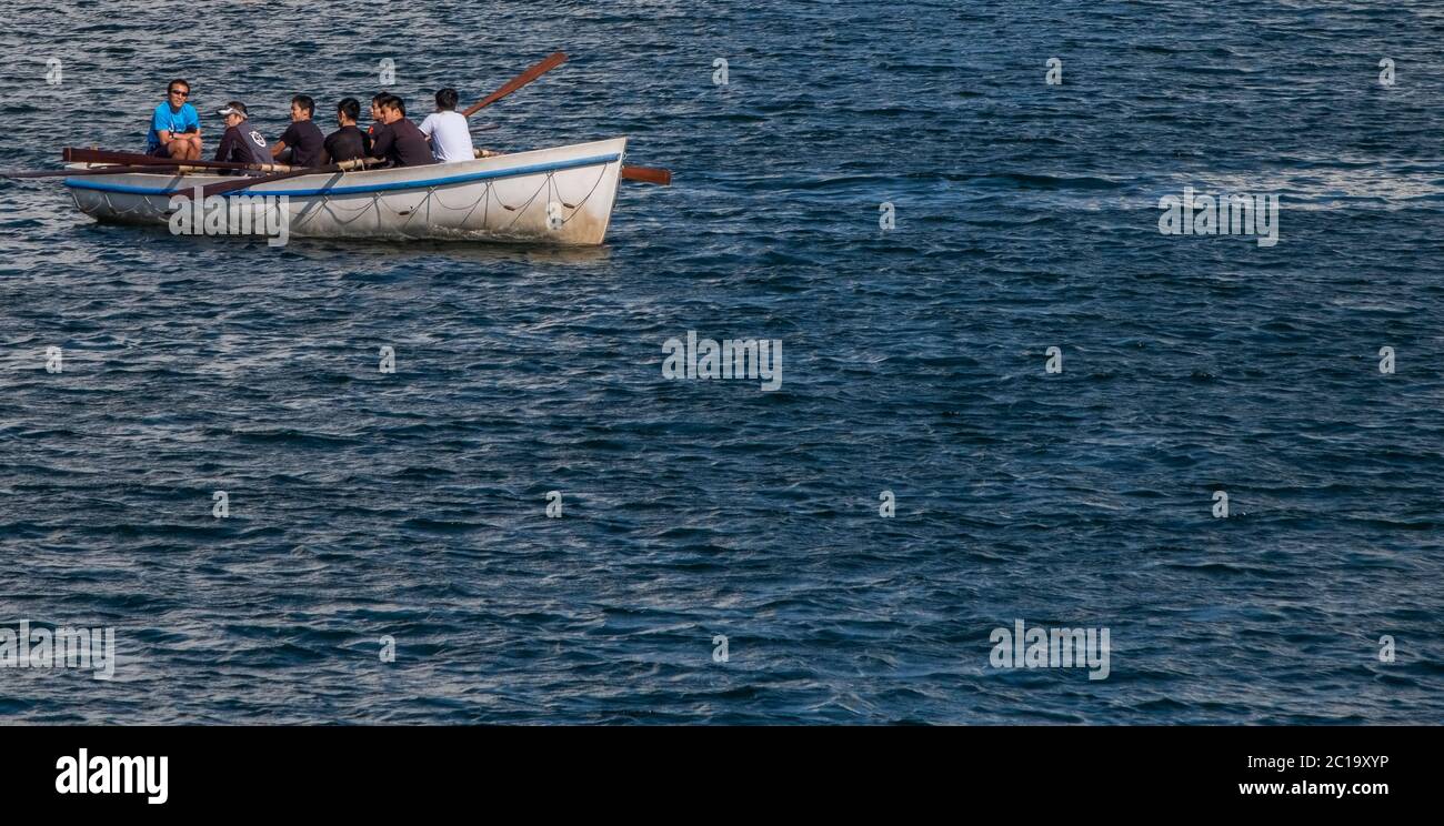 Men rowing a boat at Yokohama waterfront, Japan Stock Photo Alamy
