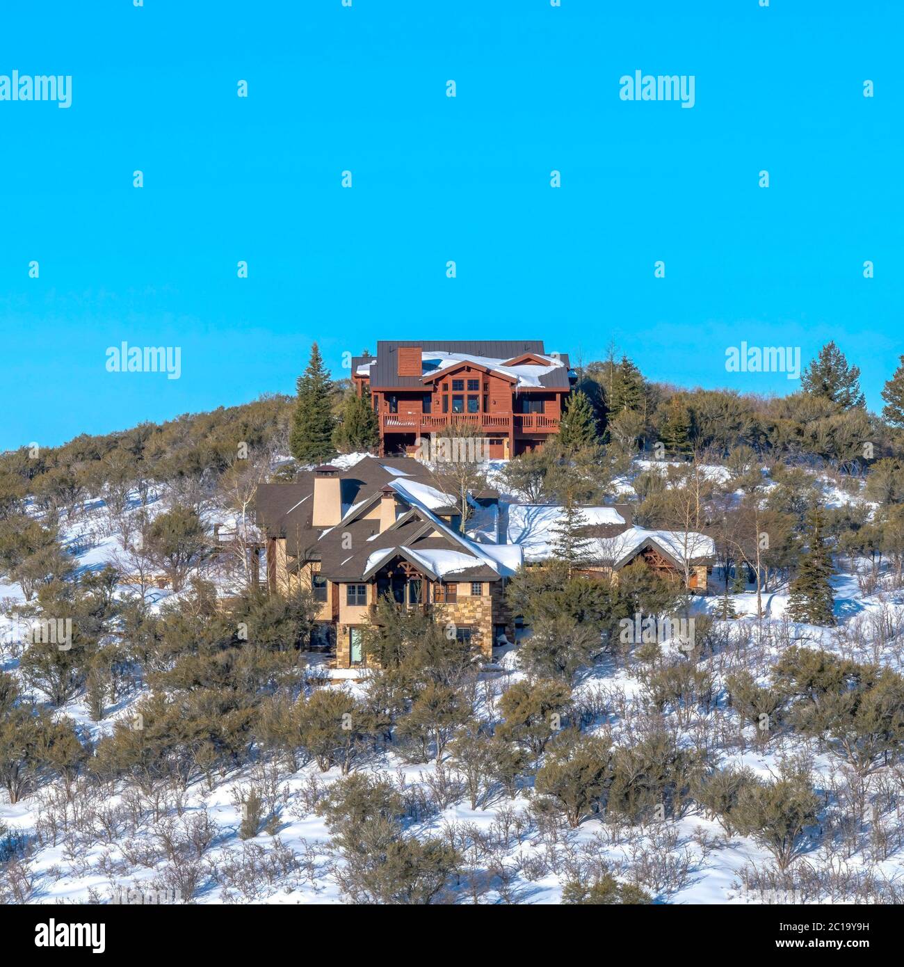 Square Hill top houses in Park City Utah amidst scenery of snow and ...