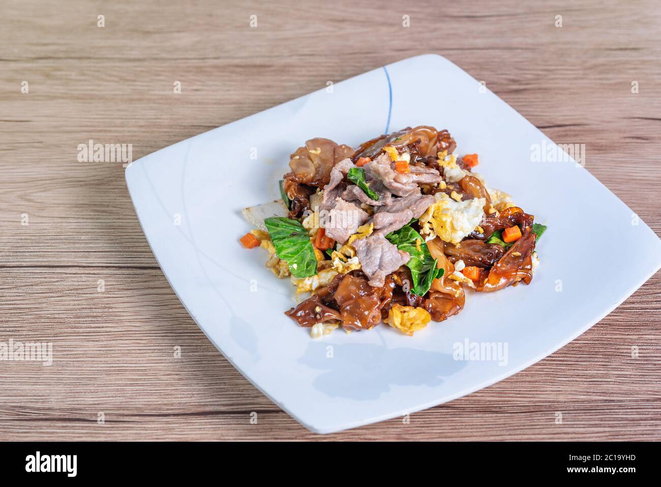 Stir fried wide rice noodles and  pork with black soy sauce  (Pad See Ew) Stock Photo