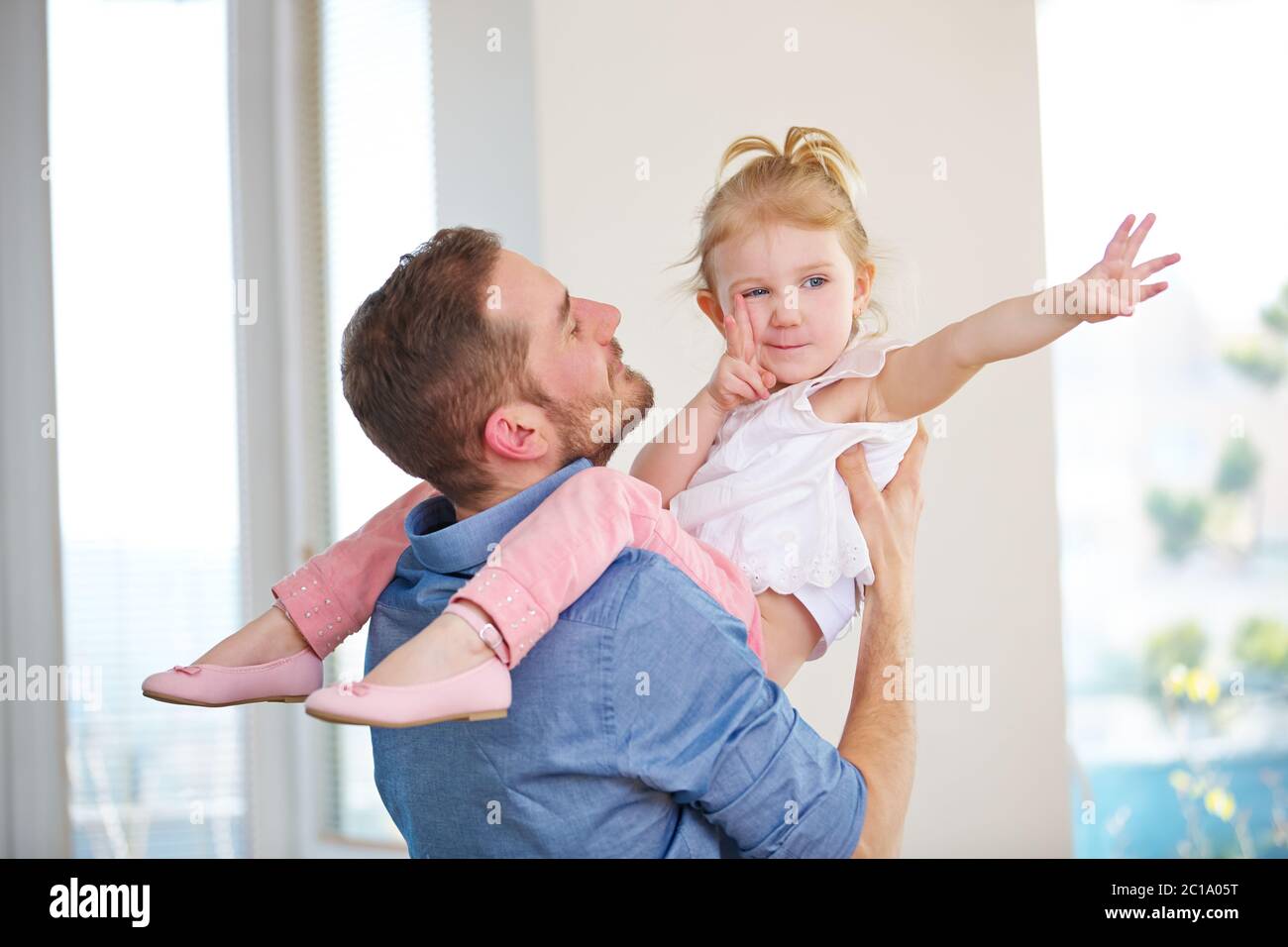 Family with father and daughter at home playing together Stock Photo ...