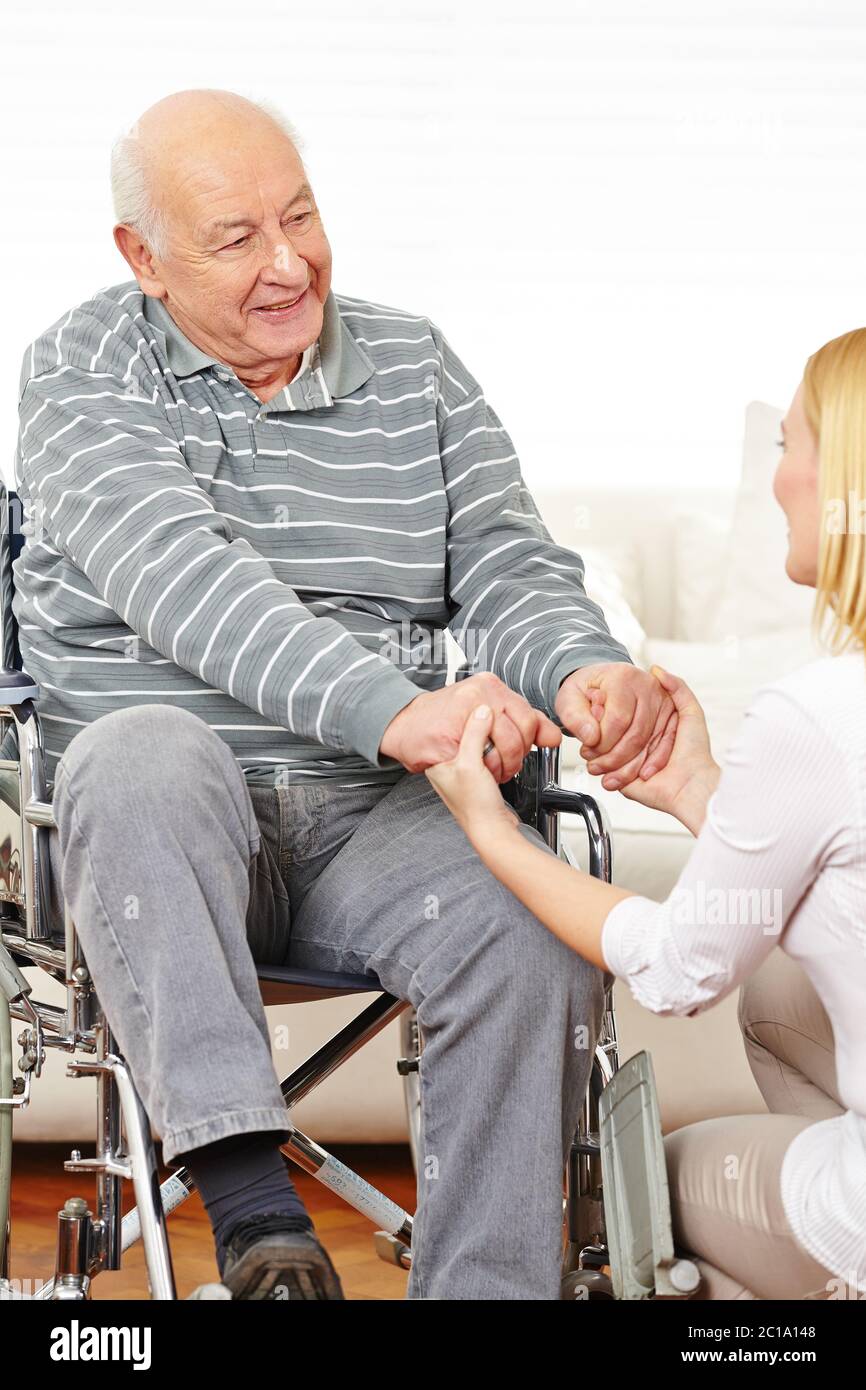 Old man in a wheelchair does rehab at home Stock Photo Alamy