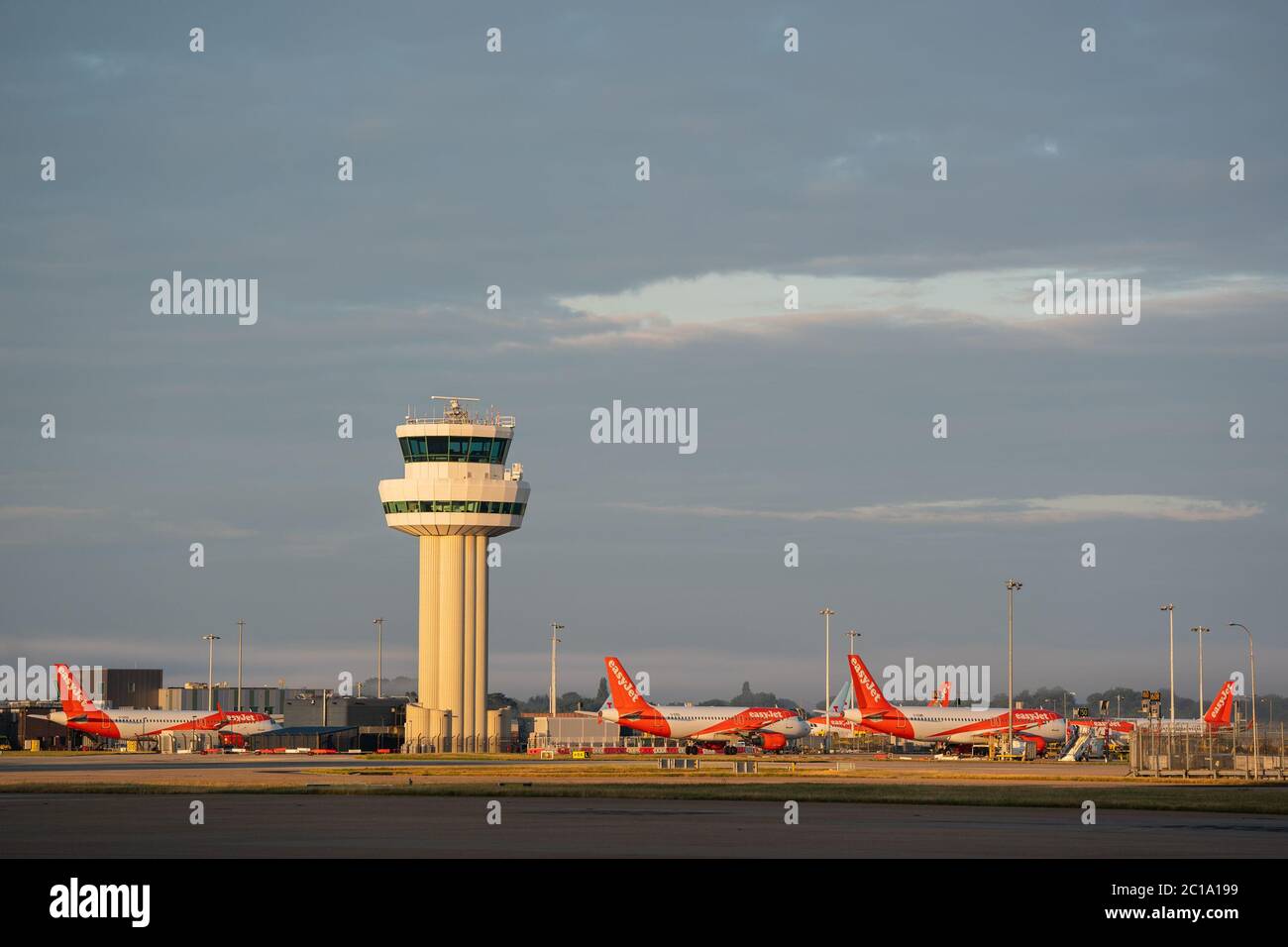 EasyJet airplanes and control tower at Gatwick North Terminal Stock Photo