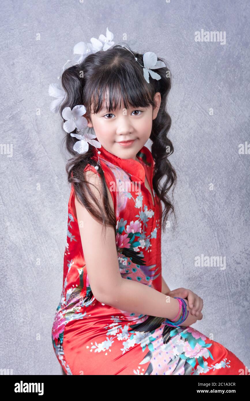 Portrait of asian little girl in red dress Stock Photo - Alamy