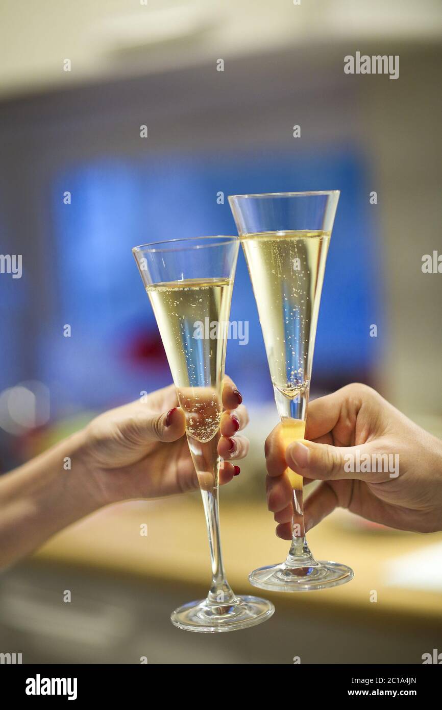 Two hands clinking champagne hi-res stock photography and images - Alamy