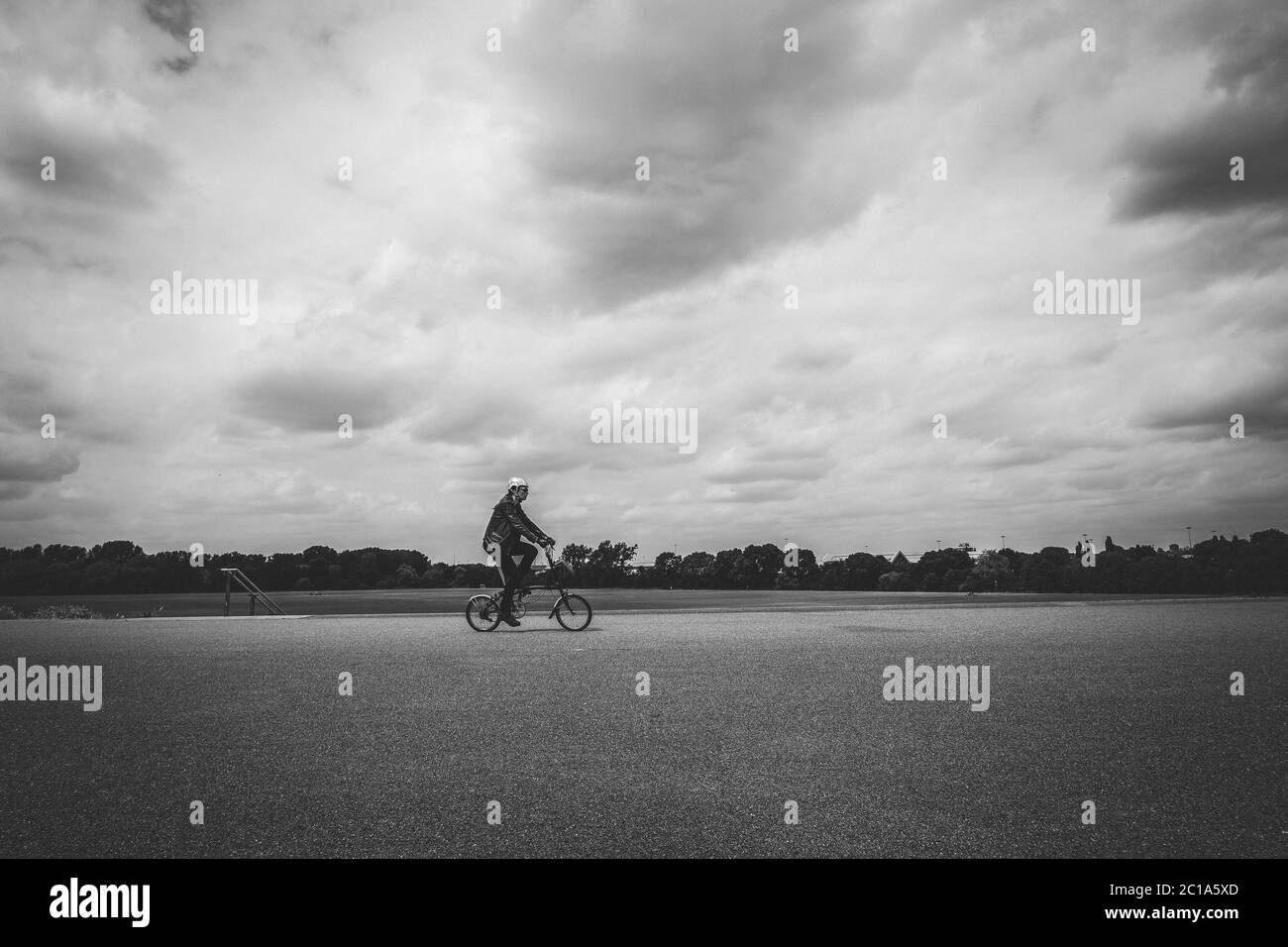 A female cyclist during covid-19 lockdown near Hackney Marshes, London Uk Stock Photo