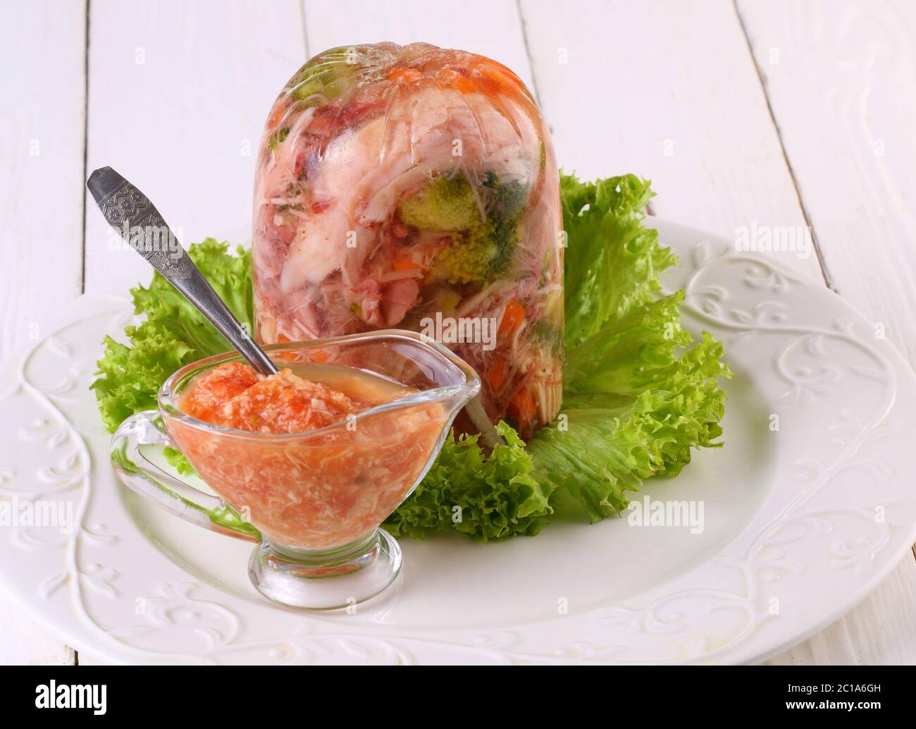 Jelly with meat. traditional Russian dish. Meat aspic with horseradish