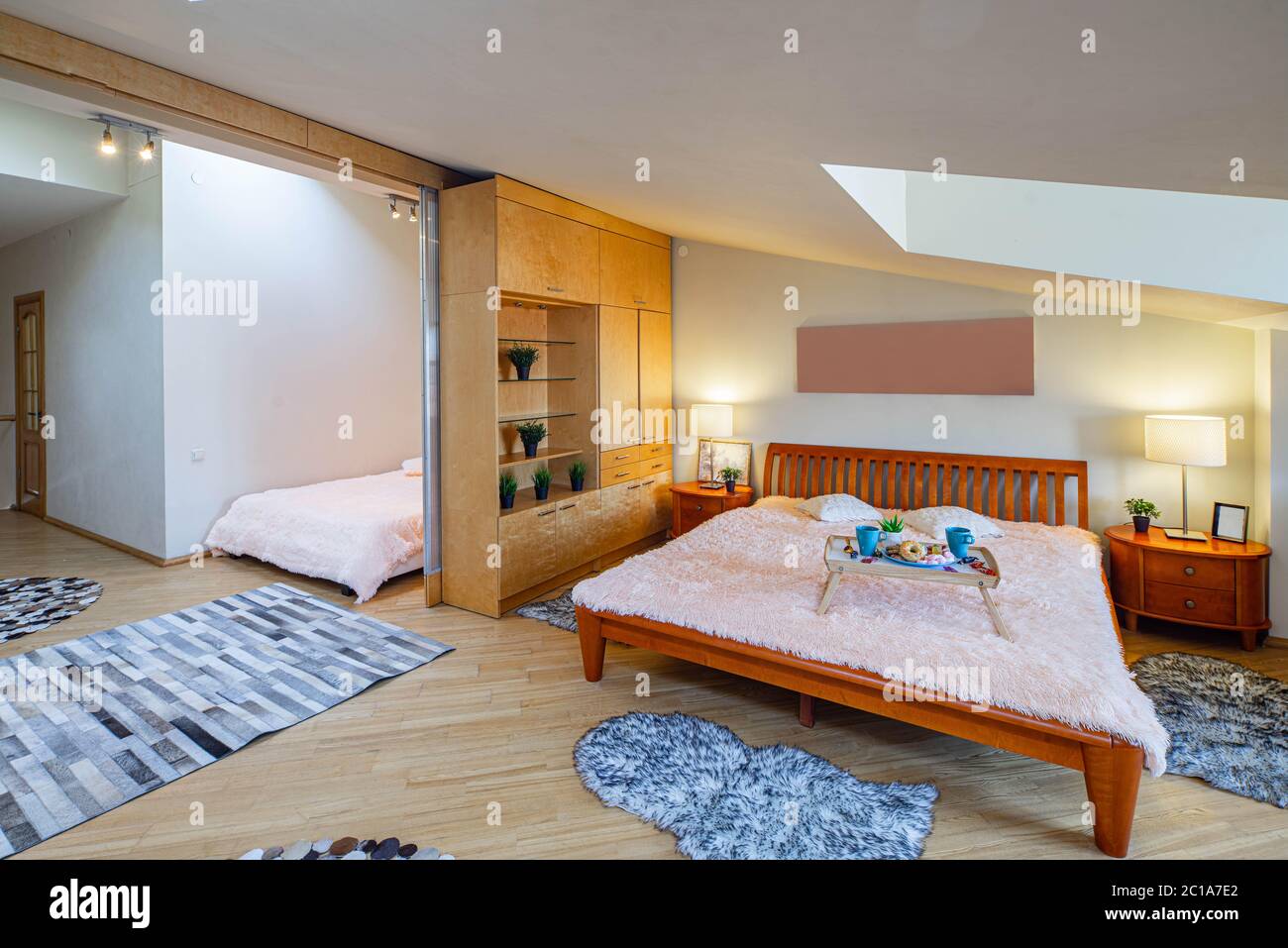 Modern interior of spacious bedroom with two beds. Luxury apartment ...