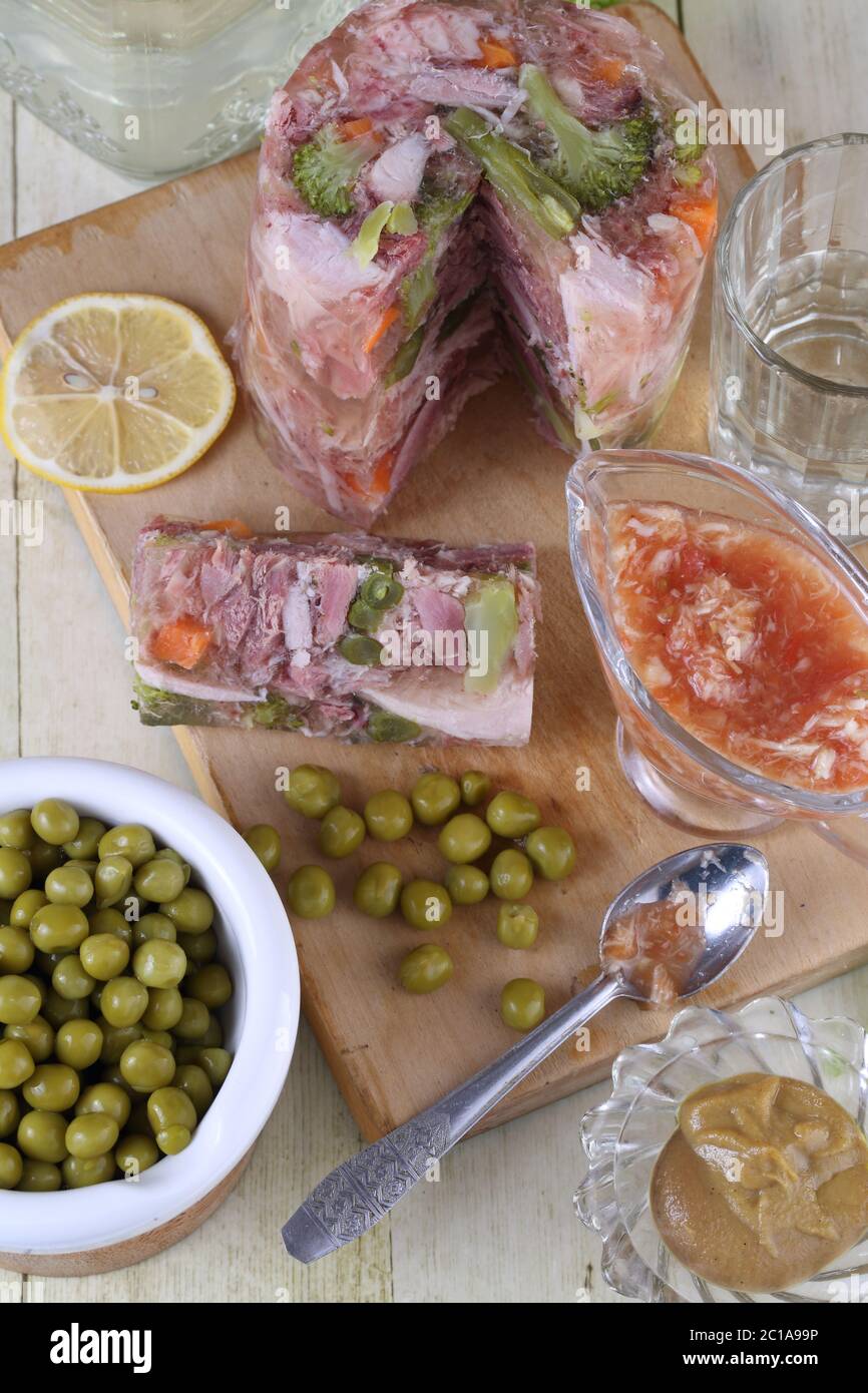 Jelly with meat. traditional Russian dish. Meat aspic with horseradish
