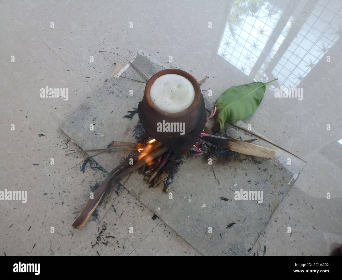 A traditional affair in Sri Lanka. Boiling milk in a clay pot on a fire