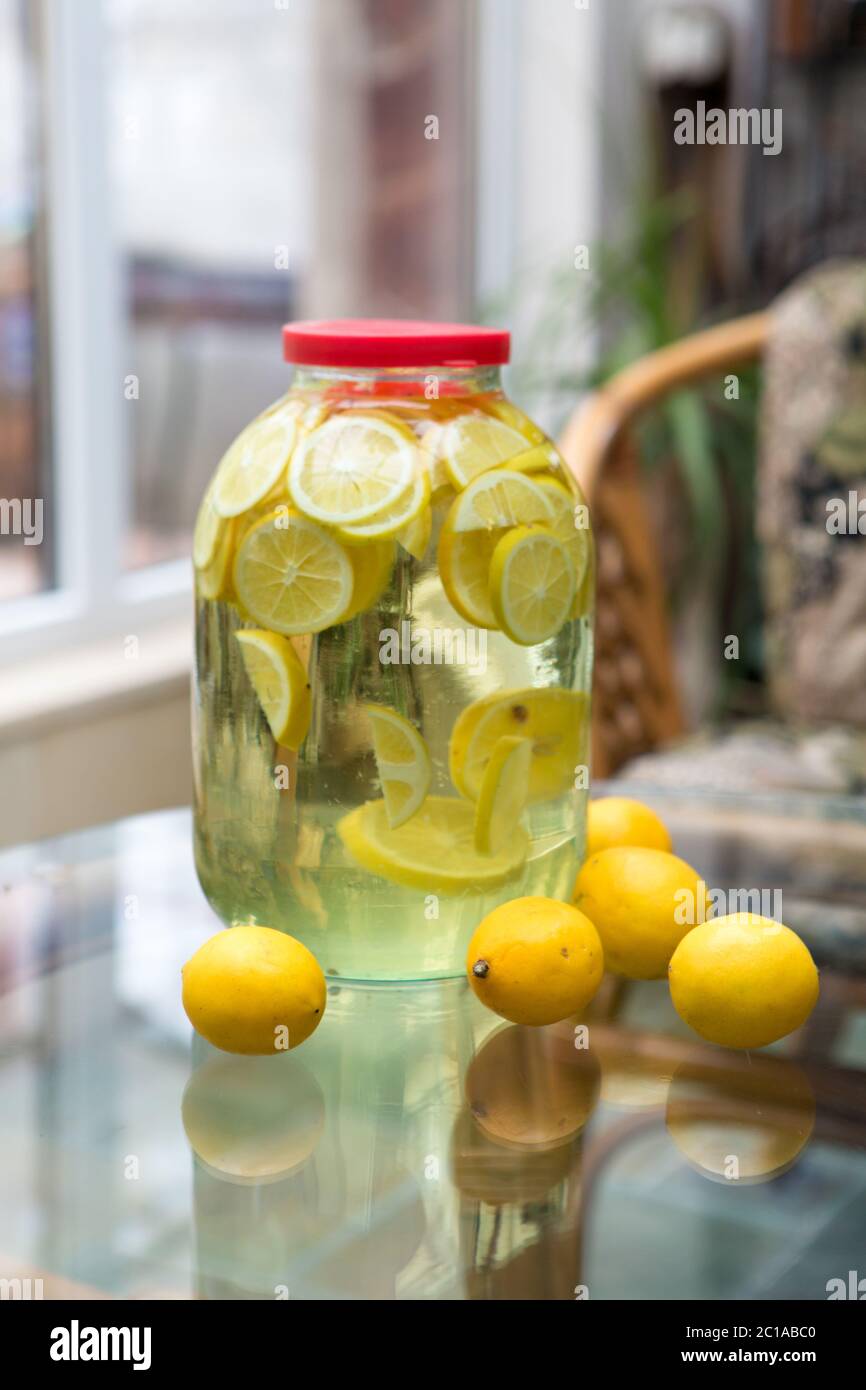 Homemade tincture with lemon Stock Photo Alamy