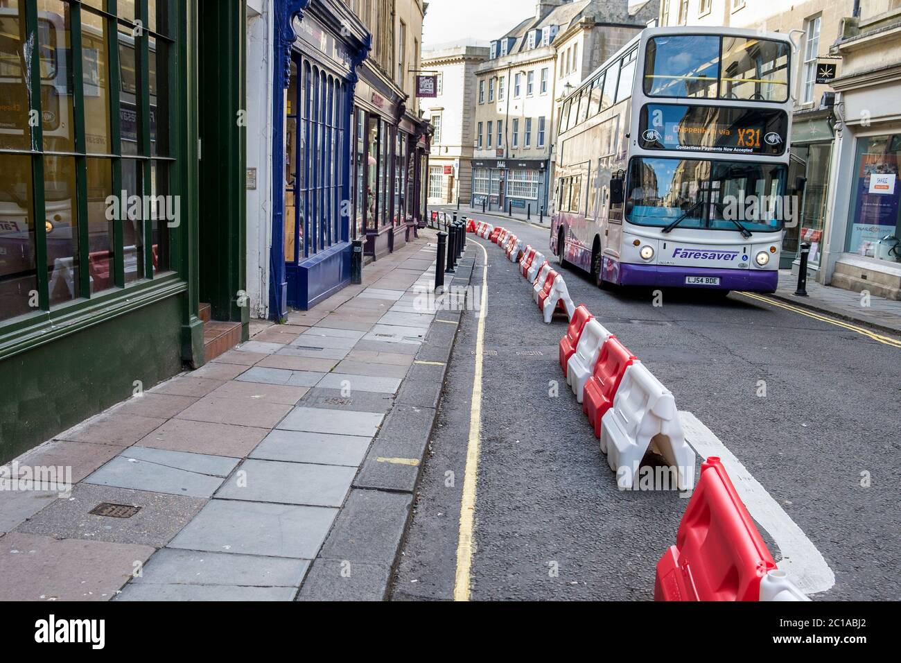 Bath, UK. 15th June, 2020. As non essential shops in England are given the green light by the government to reopen, street barriers put in place by the local council to widen the pavements in order to help with social distancing are pictured in Broad street. Credit: Lynchpics/Alamy Live News Stock Photo