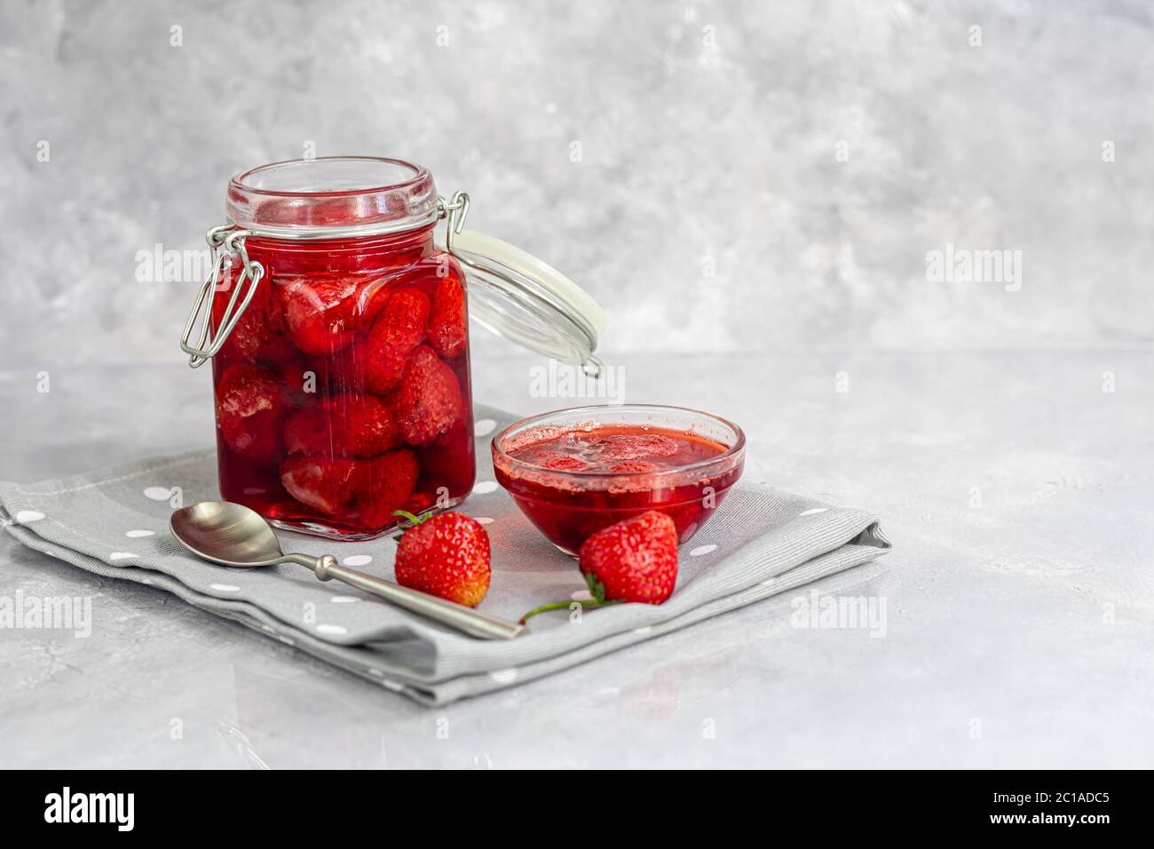 Strawberry Jam In A Glass Jar Next To Fresh Strawberries On A Gray Background Homemade Winter Fruit Blanks Selective Focus Copy Space Stock Photo Alamy