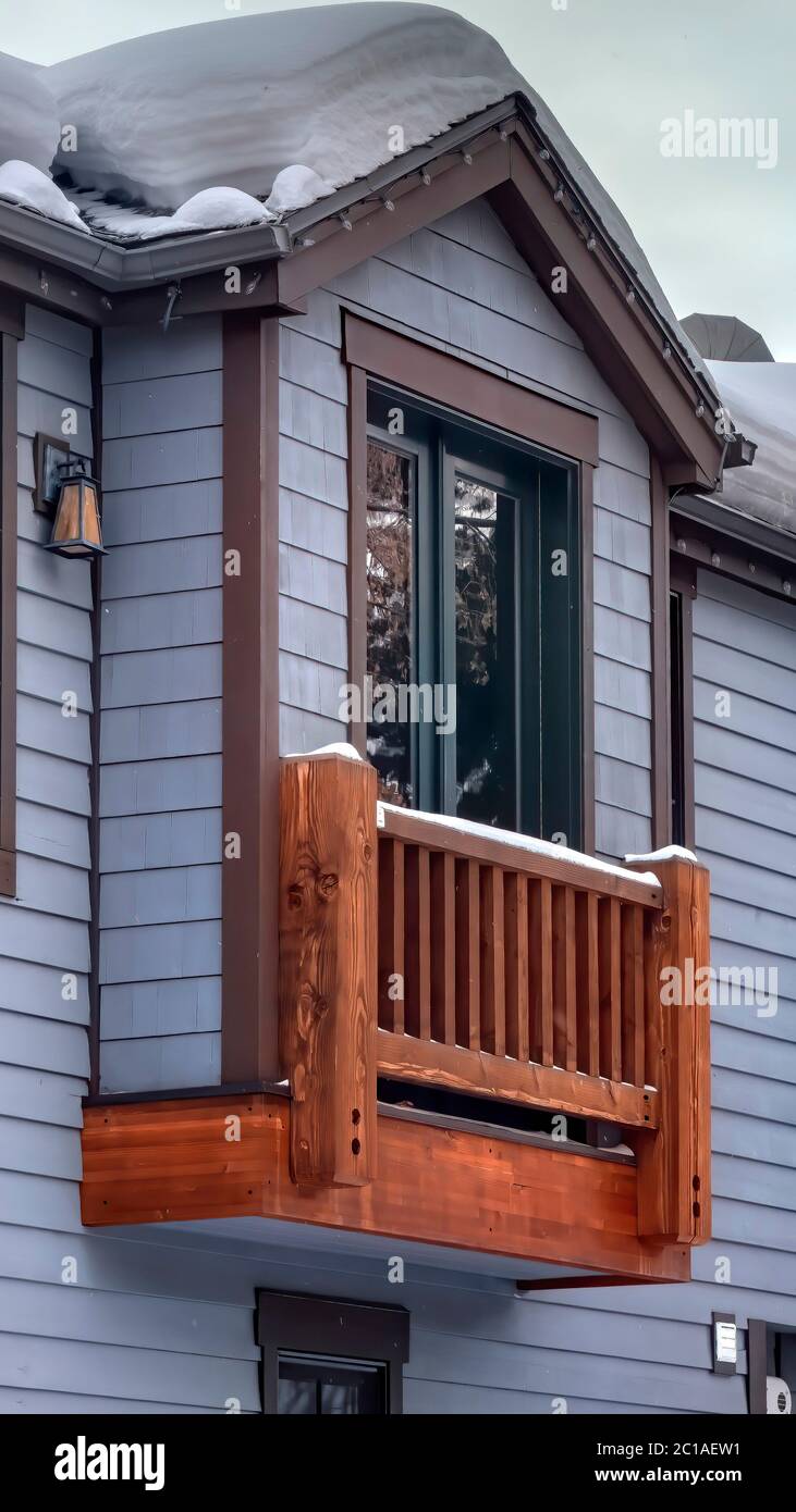 Vertical frame Box bay window of home with gable roof sliding door and