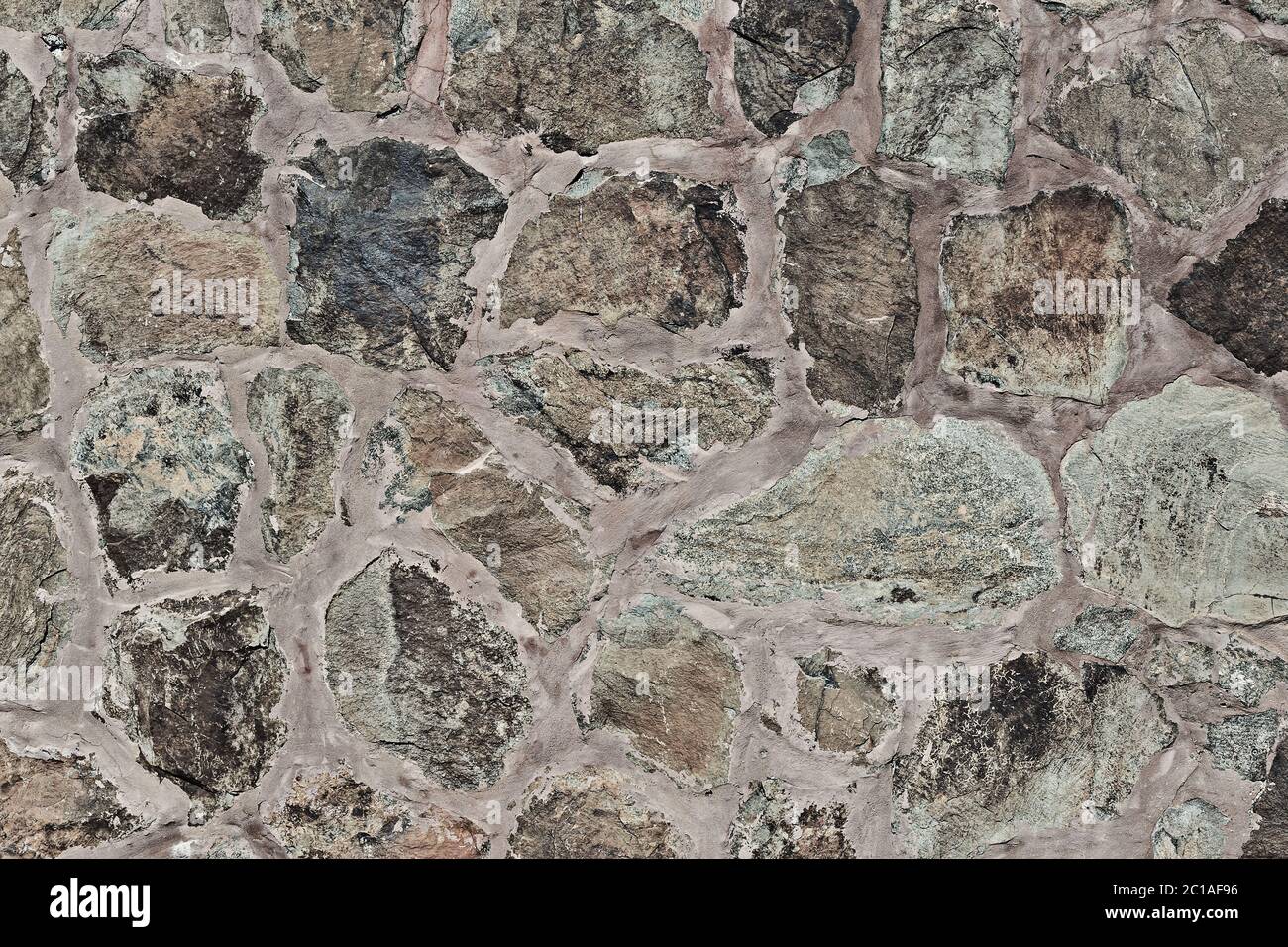 Stone wall made of natural stones - background Stock Photo - Alamy