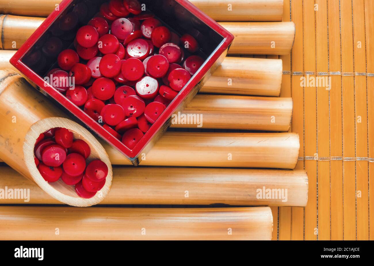 Bamboo sticks and bamboo napkin with red coral beads. Traditional