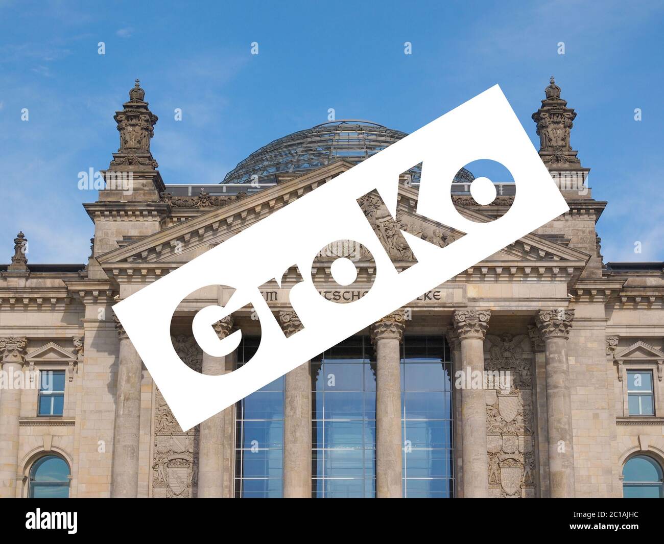Groko (Grosse Koalition) over Reichstag parliament in Berlin Stock Photo