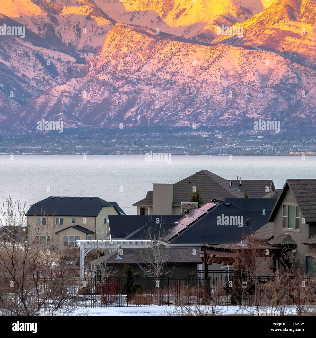 Square Scenic landscape in winter with calm lake and sunlit golden ...