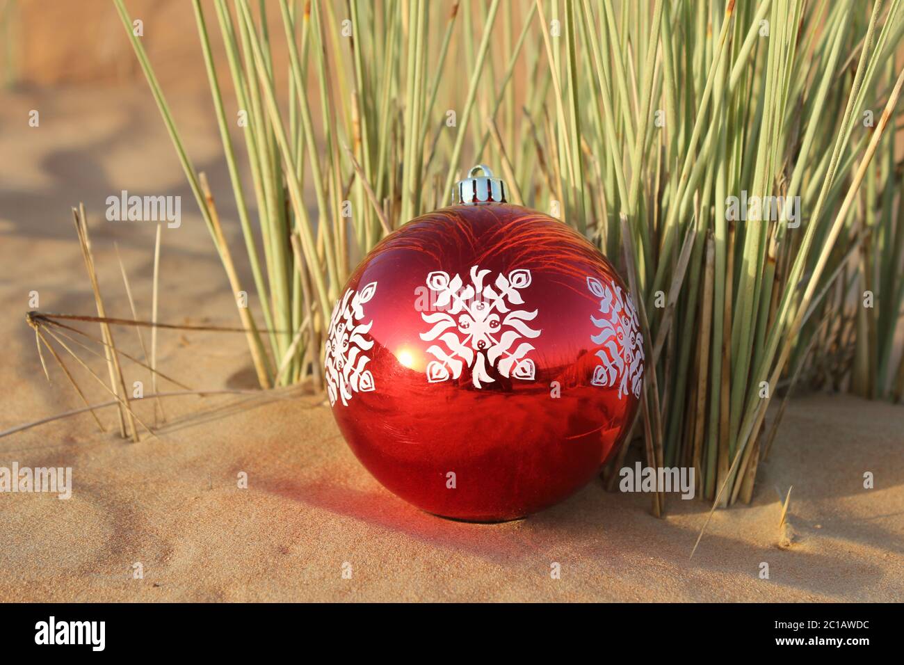 Christmas bauble ornament in rustic desert sand dune. Concept for  Christmas/Happy Holidays/Holidays/New Year/festive/festival theme  background Stock Photo - Alamy