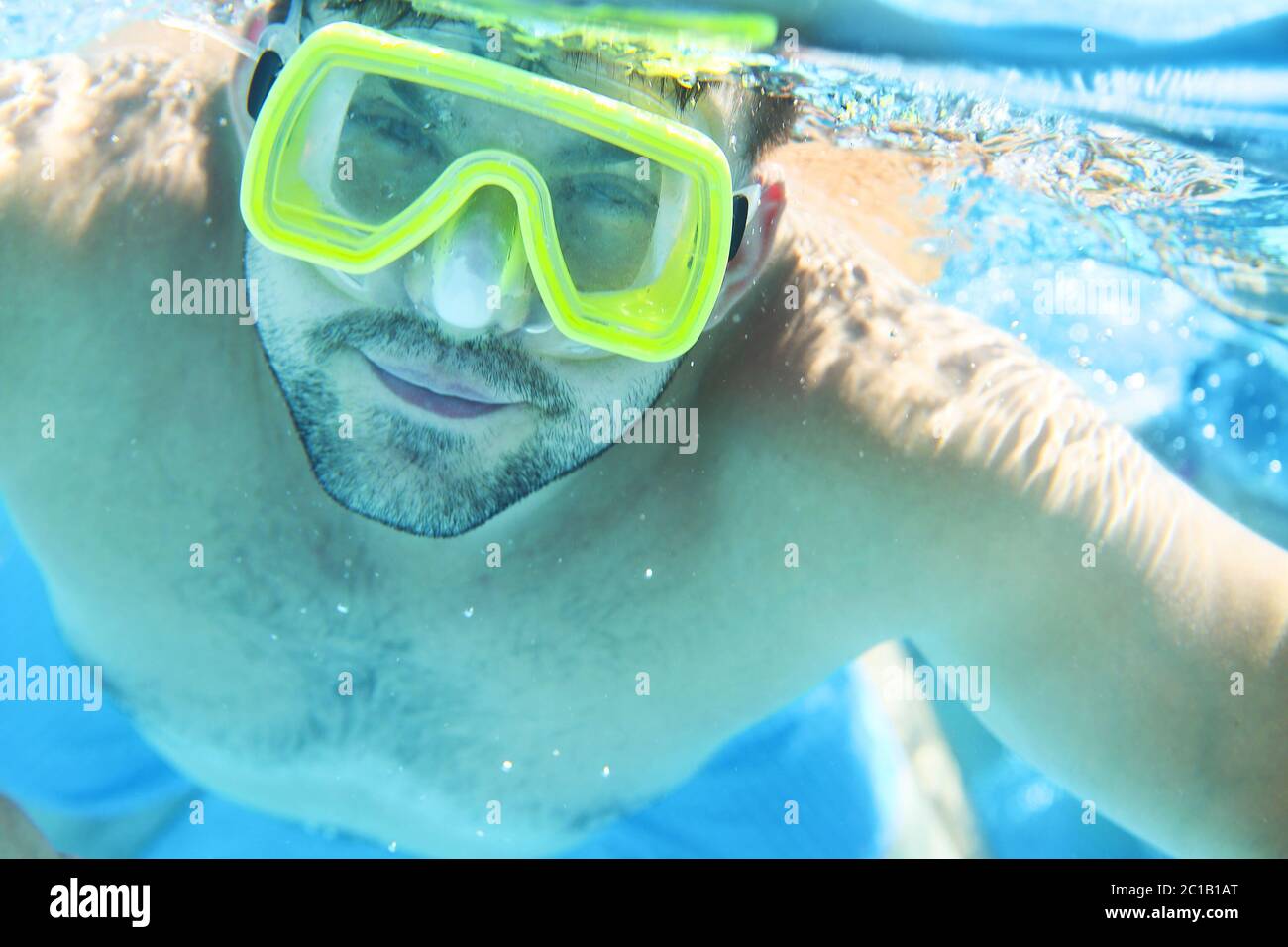 Man with snorkel mask underwater in swimming pool Stock Photo Alamy