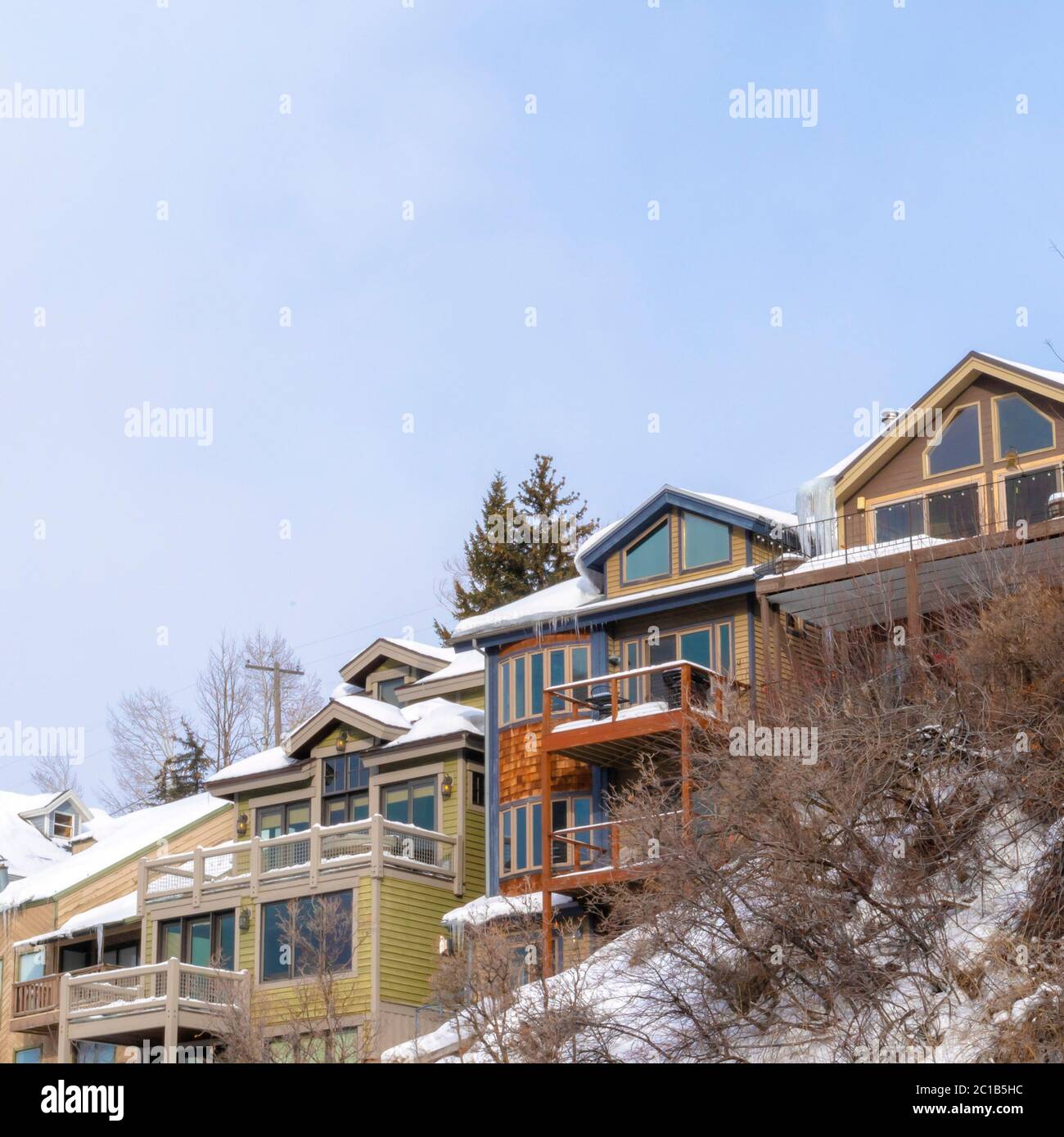 Square frame Homes with snowy roofs and balconies in scenic Park City ...