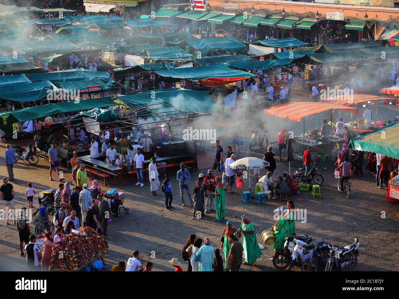 Morocco, Marrakesh - June 26, 2019: Dusk at Djemaa el Fna Square. At night the square turns into a huge open-air restaurant and hive of activity. Stock Photo