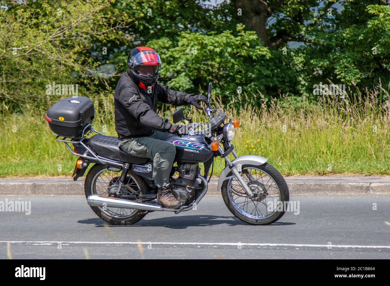 1997 90s nineties Honda CG 125 124cc ; Motorbike rider; two-wheeled transport, motorcycles, vehicle, roads, motorbikes, bike riders motoring in Chorley, UK Stock Photo