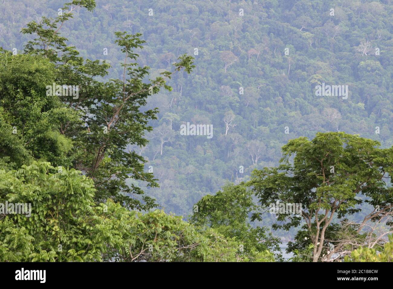 View of Lokoba Game Rerserve on Nosy Be Island from Ampangorinana Village, Nosy Komba Island, Madagascar. Stock Photo