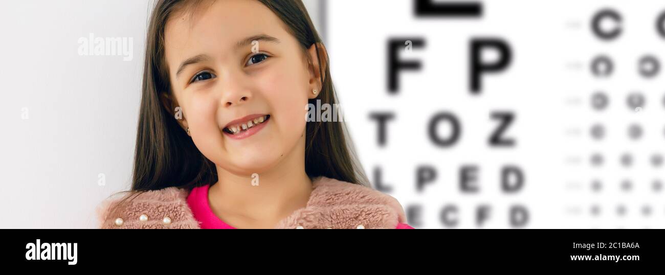 Child at eye sight test. Little kid selecting glasses at optician store. Eyesight measurement for school kids. Eye wear for children. Doctor Stock Photo