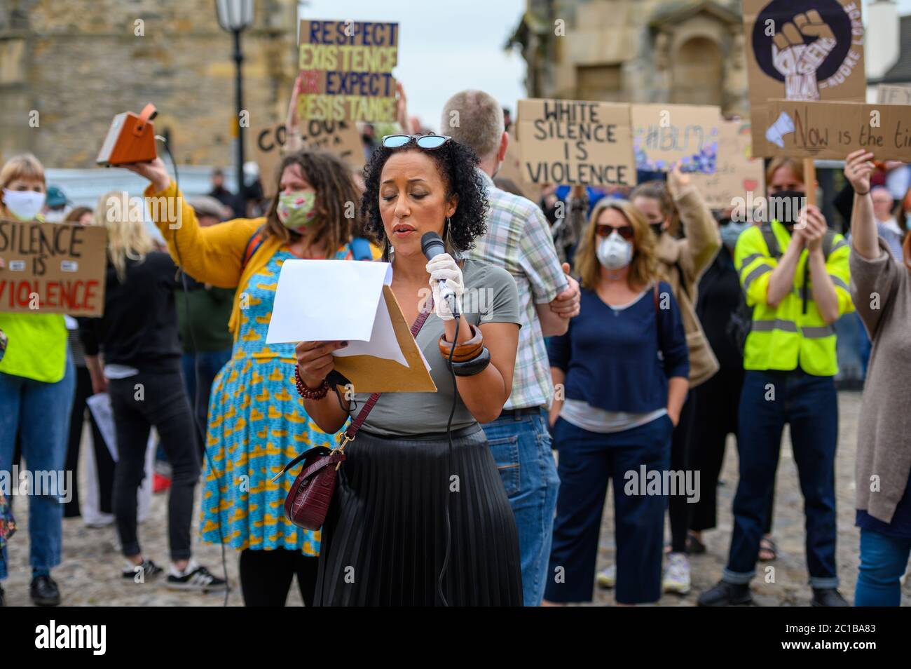 Richmond, North Yorkshire, UK - June 14, 2020: Protesters holding placards listen to a female speaker at a Black Lives Matter protest in Richmond, Nor Stock Photo