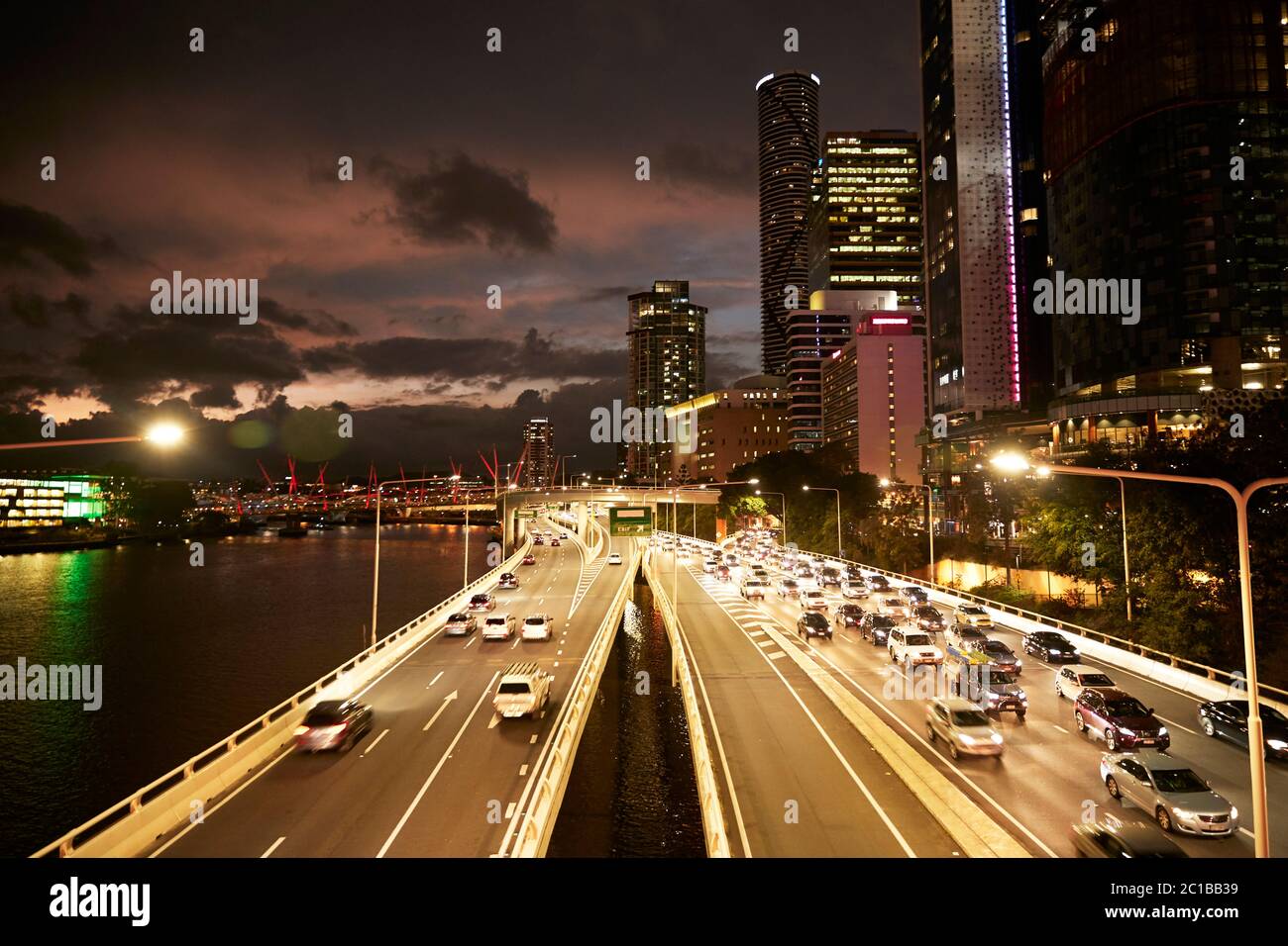 Elevated view of a major roadway and traffic leaving the city of Brisbane at night. Stock Photo
