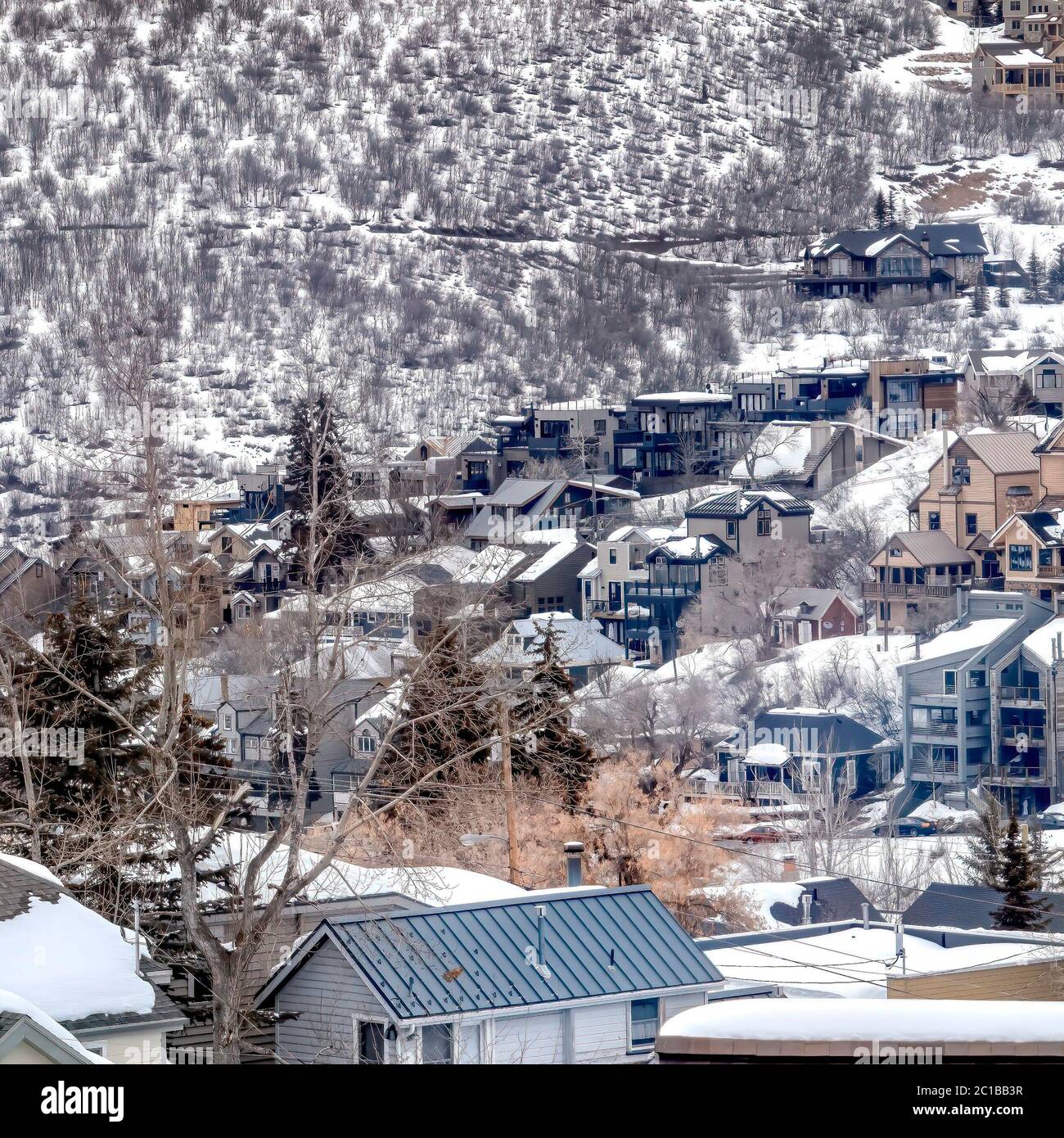 Square frame Park City Utah mountain in winter with colorful homes that ...