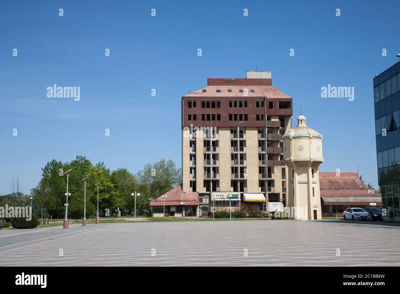 VUKOVAR, CROATIA - APRIL 20, 2018: Hotel Dunav, an abandoned hotel and a major landmark of Vukovar, Croatia, in front of the main square of the city i Stock Photo