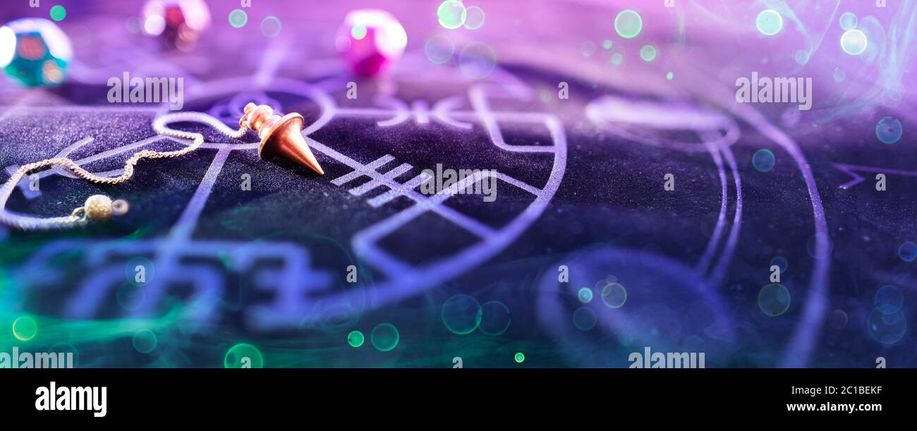 Esoteric Concept - Pendulum On Blurred Altar With Smoke And Bokeh Stock Photo