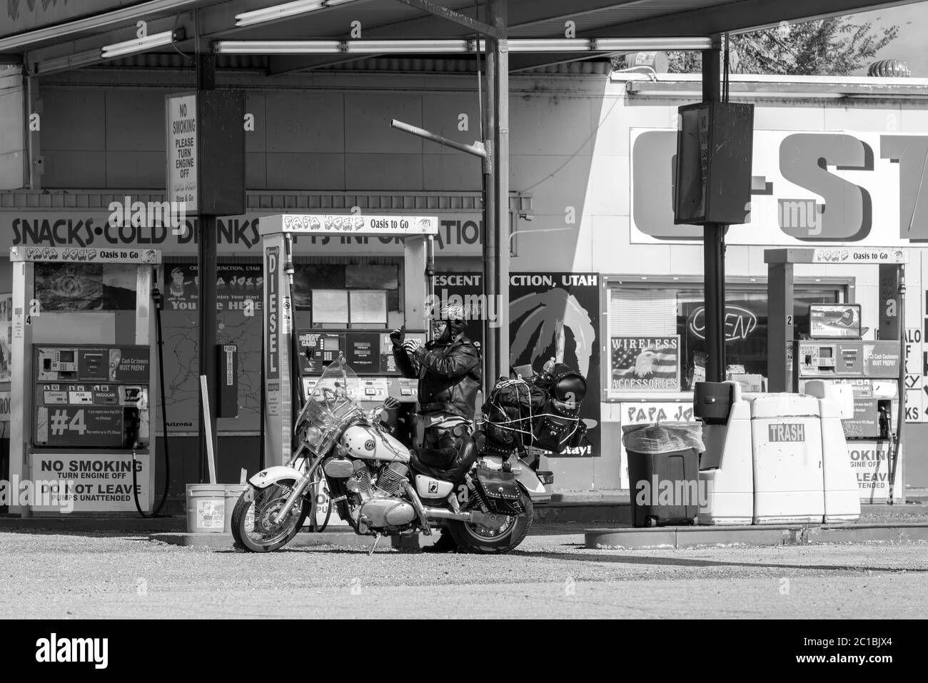 USA, Utah ,Crescent Junction, Bike on gas station Stock Photo