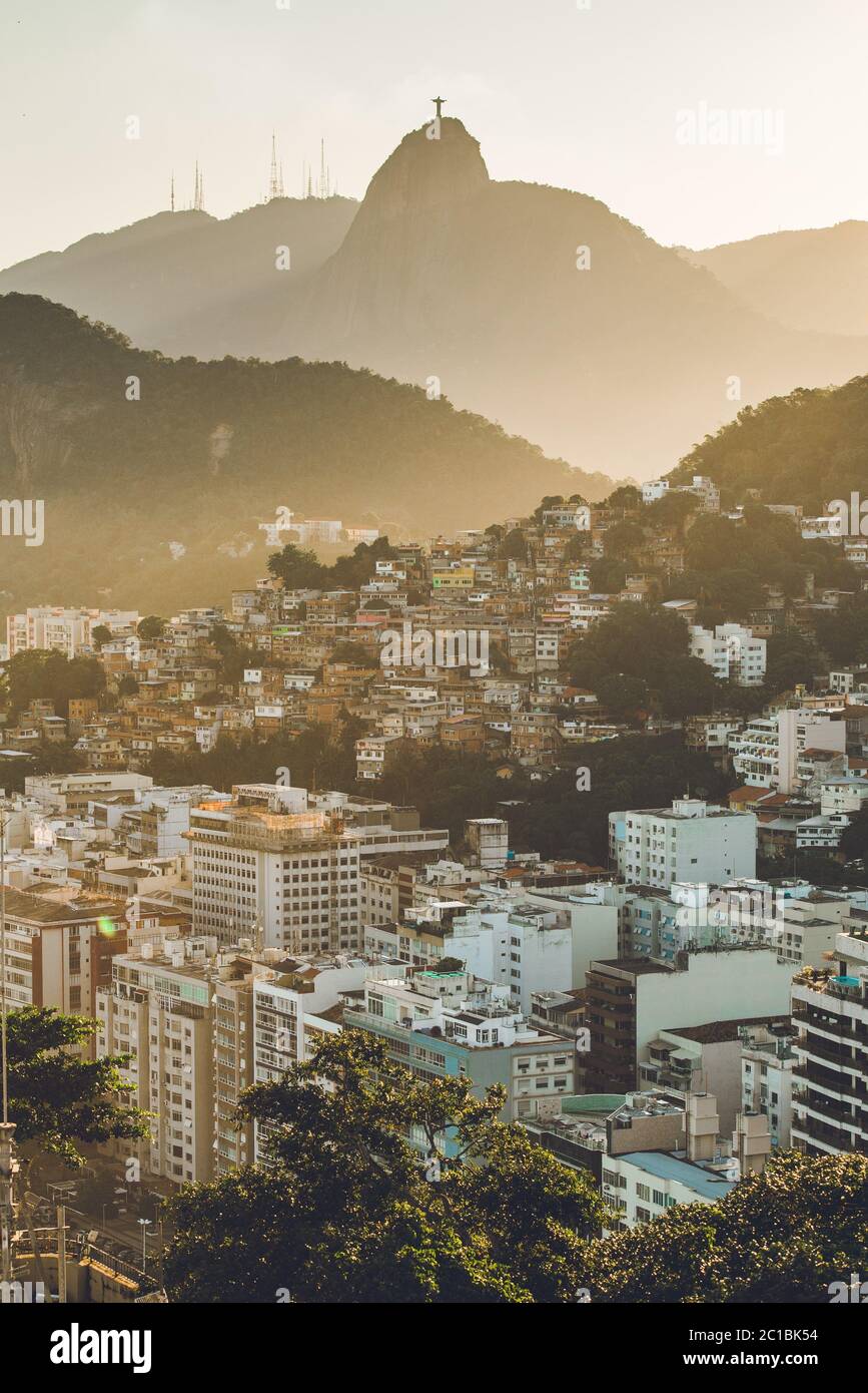 Sunset View in Copacabana, Apartment Buildings, Favela Babilonia, Mountains, and Corcovado With Christ Statue, in Rio de Janeiro, Brazil Stock Photo