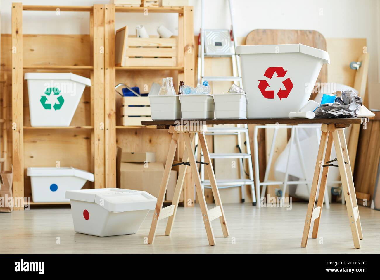 Image of big and small containers for garbage on the table sorted for plastic and papers Stock Photo