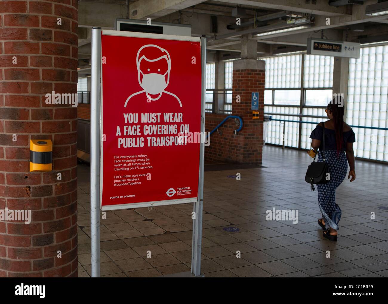 A sign telling people to put on protective face masks on display in London, England on June 15th 2020 - The Government enforced a new law which makes it mandatory to wear a protective face masks on all public transport to help stop the transmission of COVID-19 in the UK. (Credit: Jacques Feeney | MI News) Credit: MI News & Sport /Alamy Live News Stock Photo