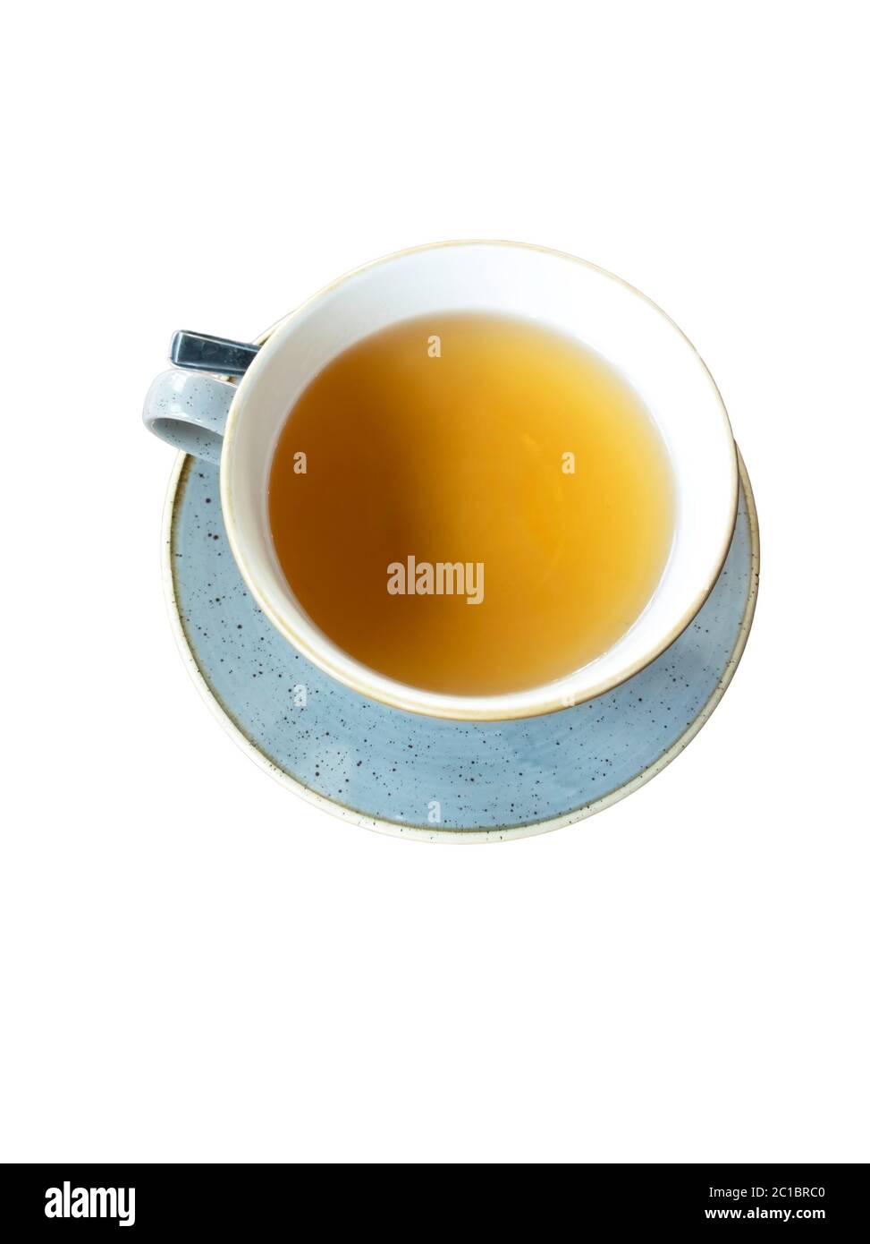 Hot herbal tea in a blue speckled cup Stock Photo