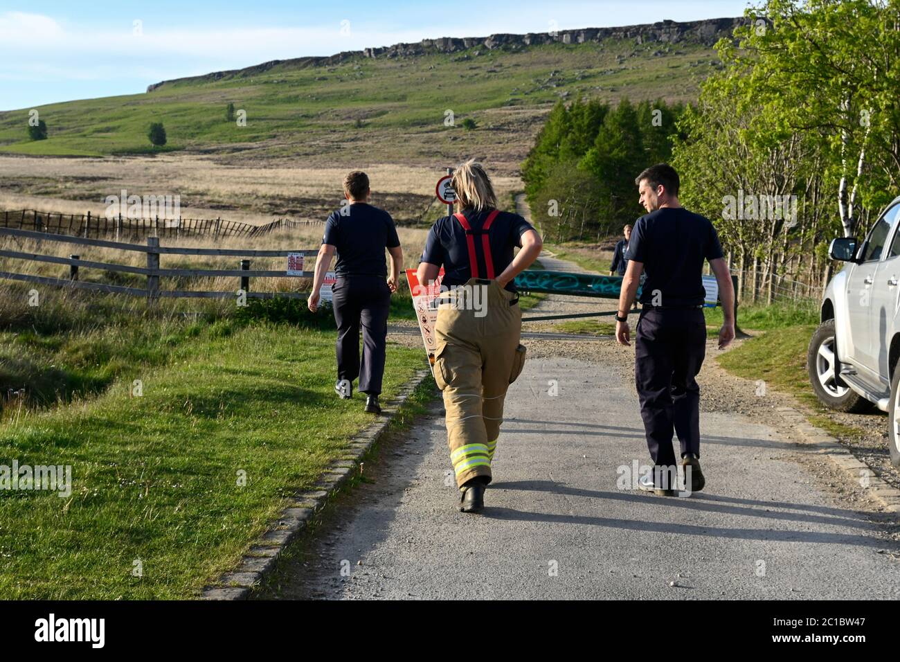 Staff from the Derbyshire fire service putting warning notices out in