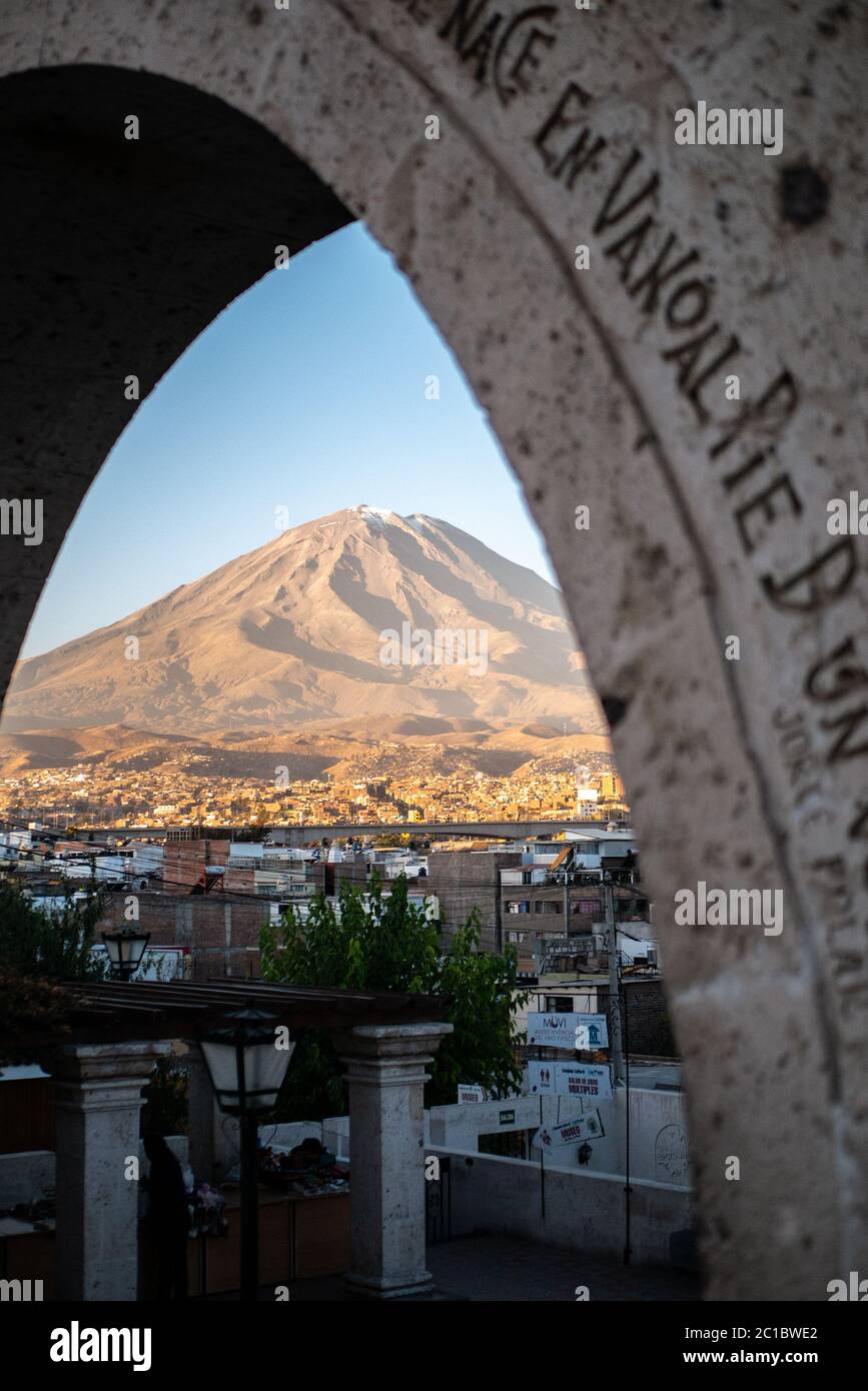 A view on El Misti Volcano in Arequipa, Peru seen through the Portals of the Yanahuara - an archeological landmark of Arequipa. Stock Photo