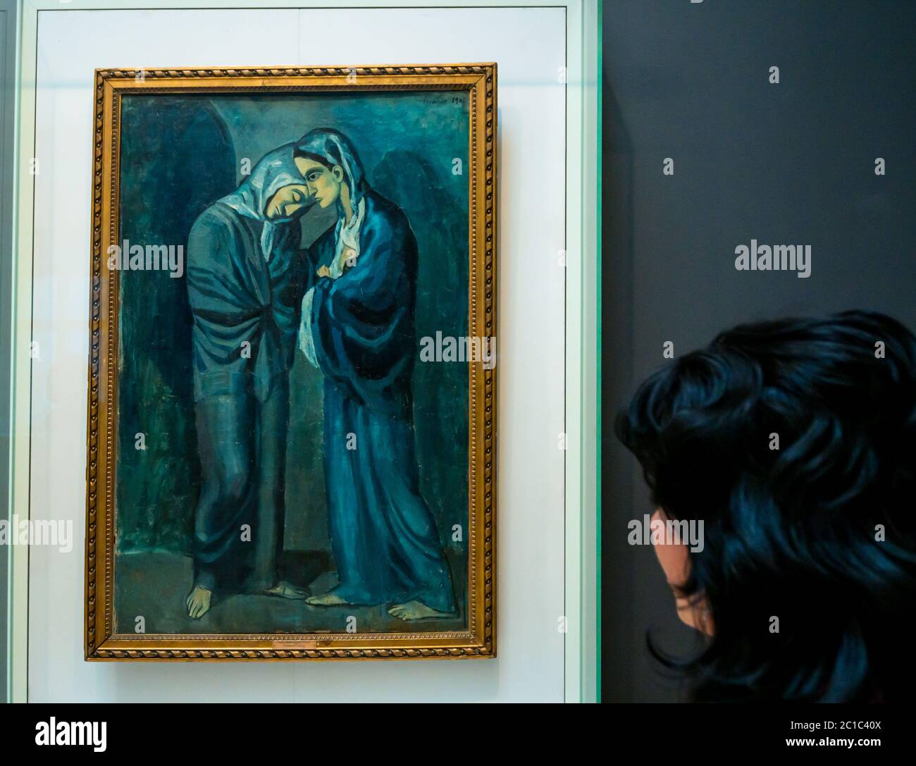 Woman looking at Two Sisters The Visit painting by Pablo Picasso, Hermitage Museum, General Staff Building, St Petersburg, Russia Stock Photo