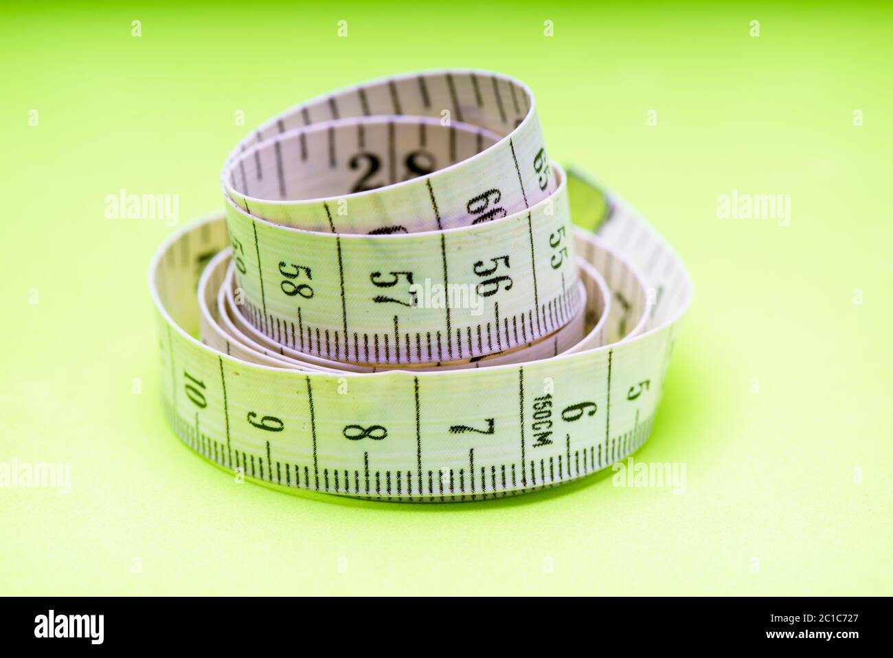 Female hands using wooden tailor ruler to measure cotton fabric. Textile  sale and sewing concept Stock Photo - Alamy