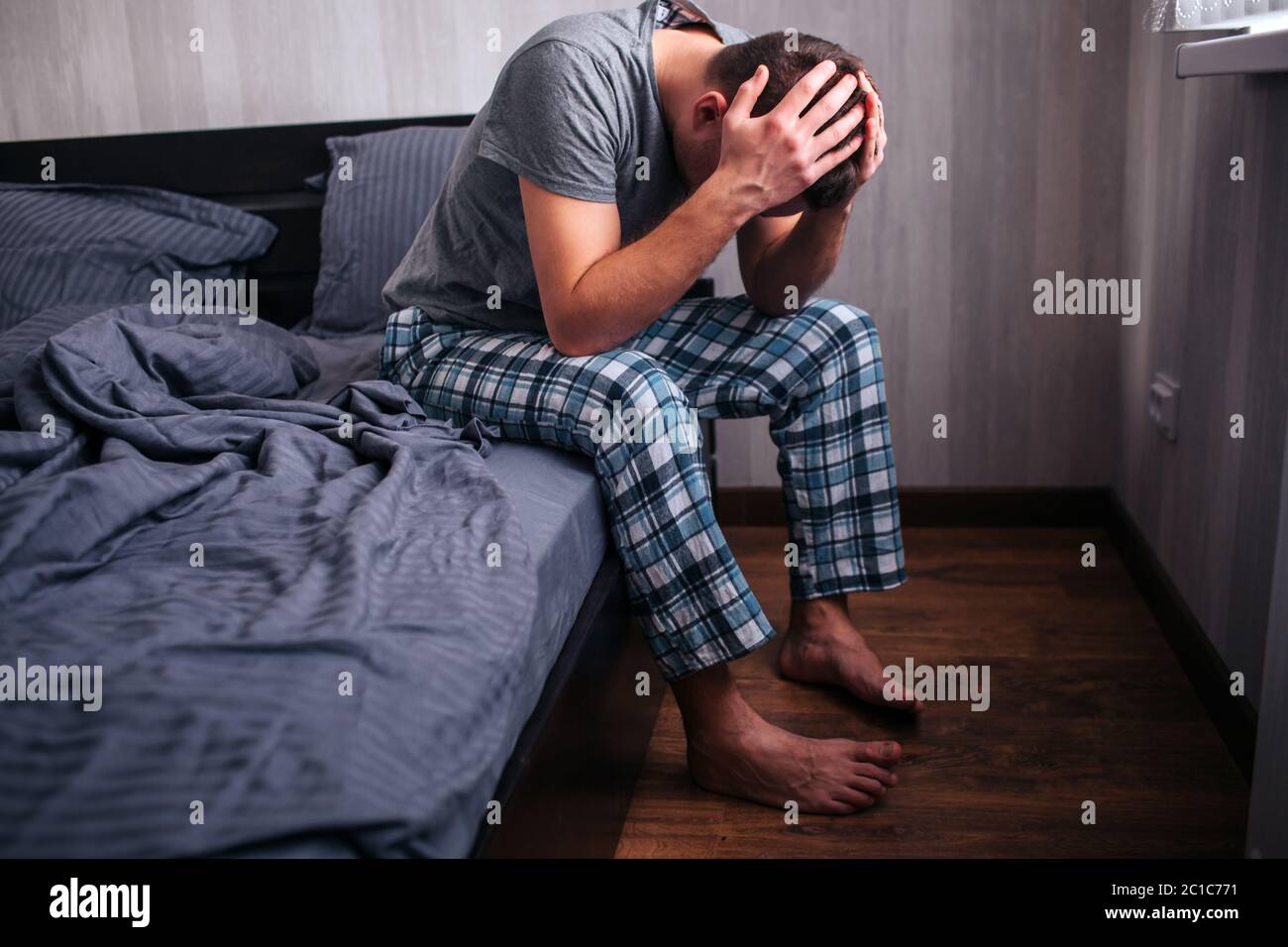 bad mood in the morning. Men's health problems. Impotence or prostatitis in a male model. Stock Photo