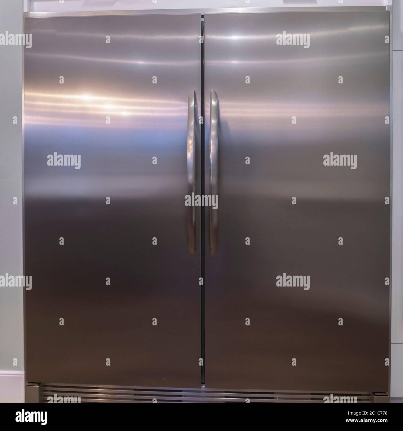 Square frame Large double door fridge with fitted ovens Stock Photo Alamy