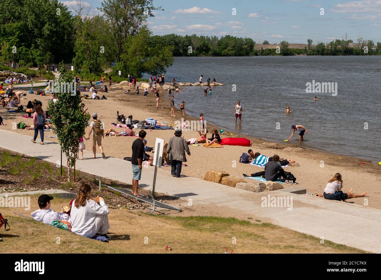 Verdun, CA - 20 June 2020 : People enjoying a warm spring day at Verdun beach near Montreal Stock Photo