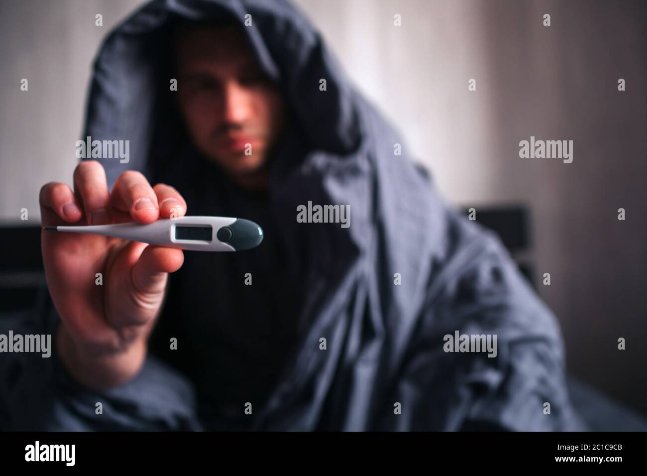 Shows in the camera an electronic meter for measuring body temperature. Stock Photo