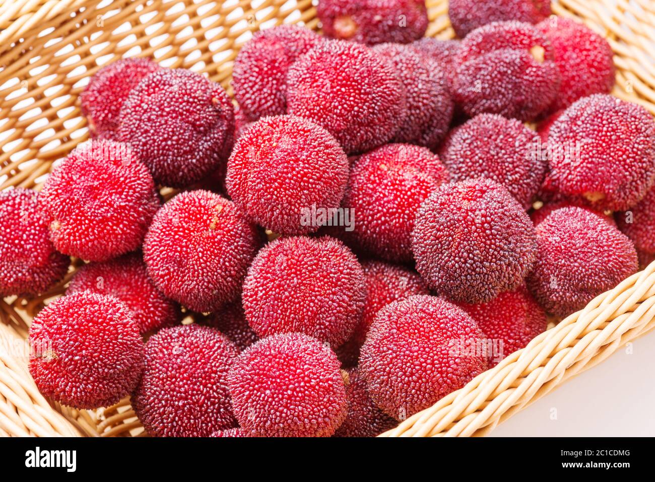 red and ripe waxberry under white background Stock Photo