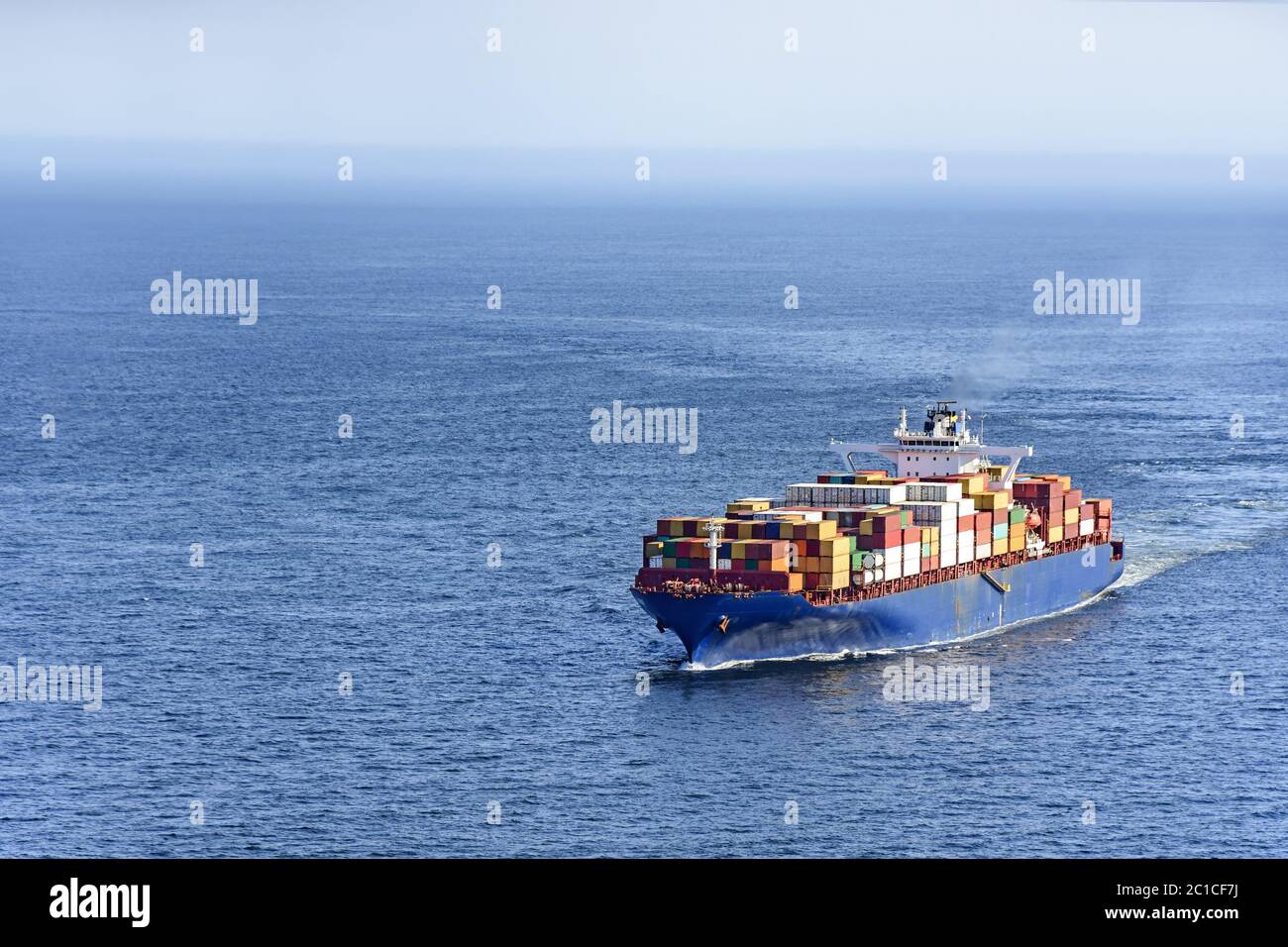 Cargo ship over ocean Stock Photo