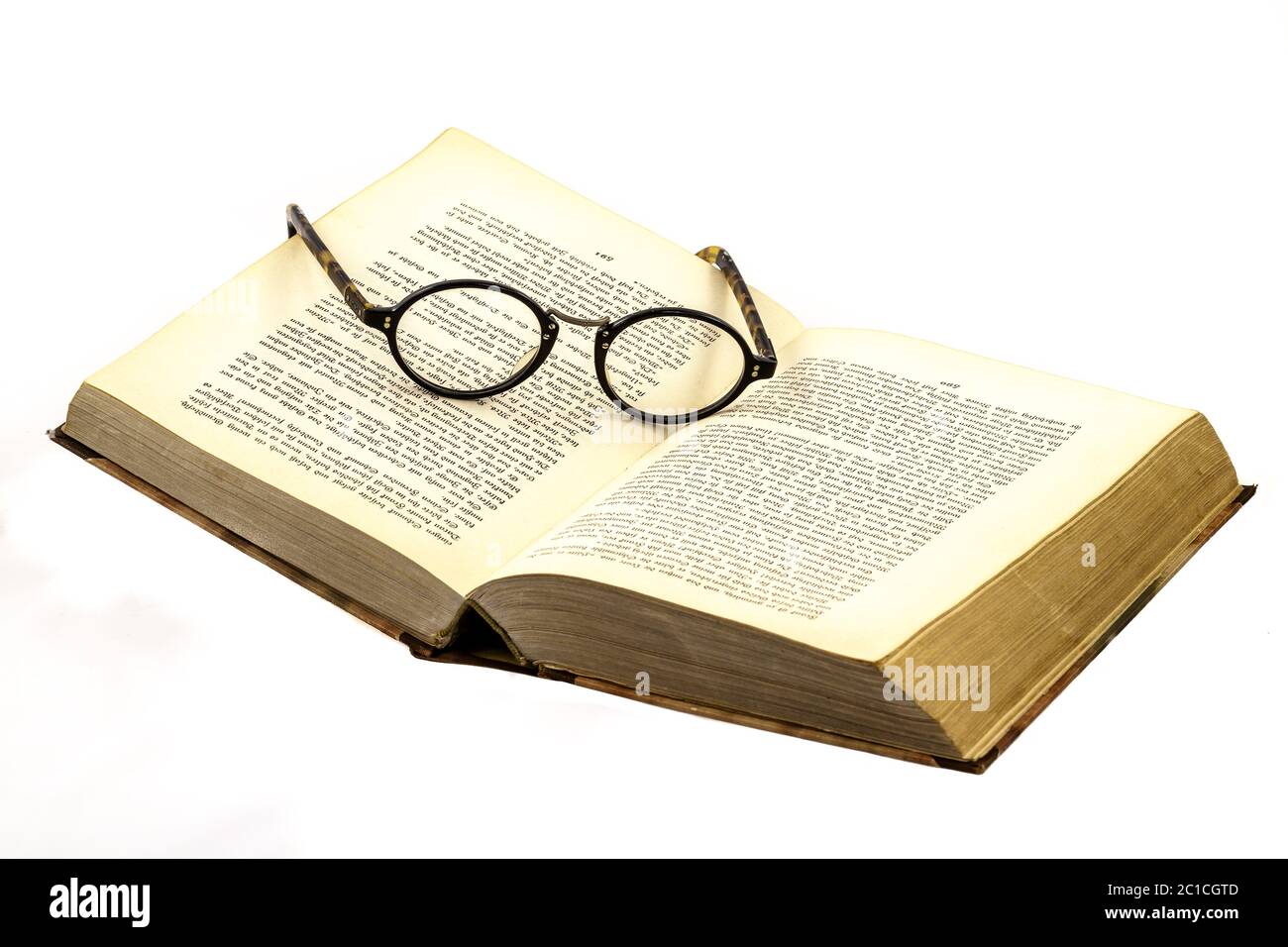 The glasses in the book with Old German script Stock Photo